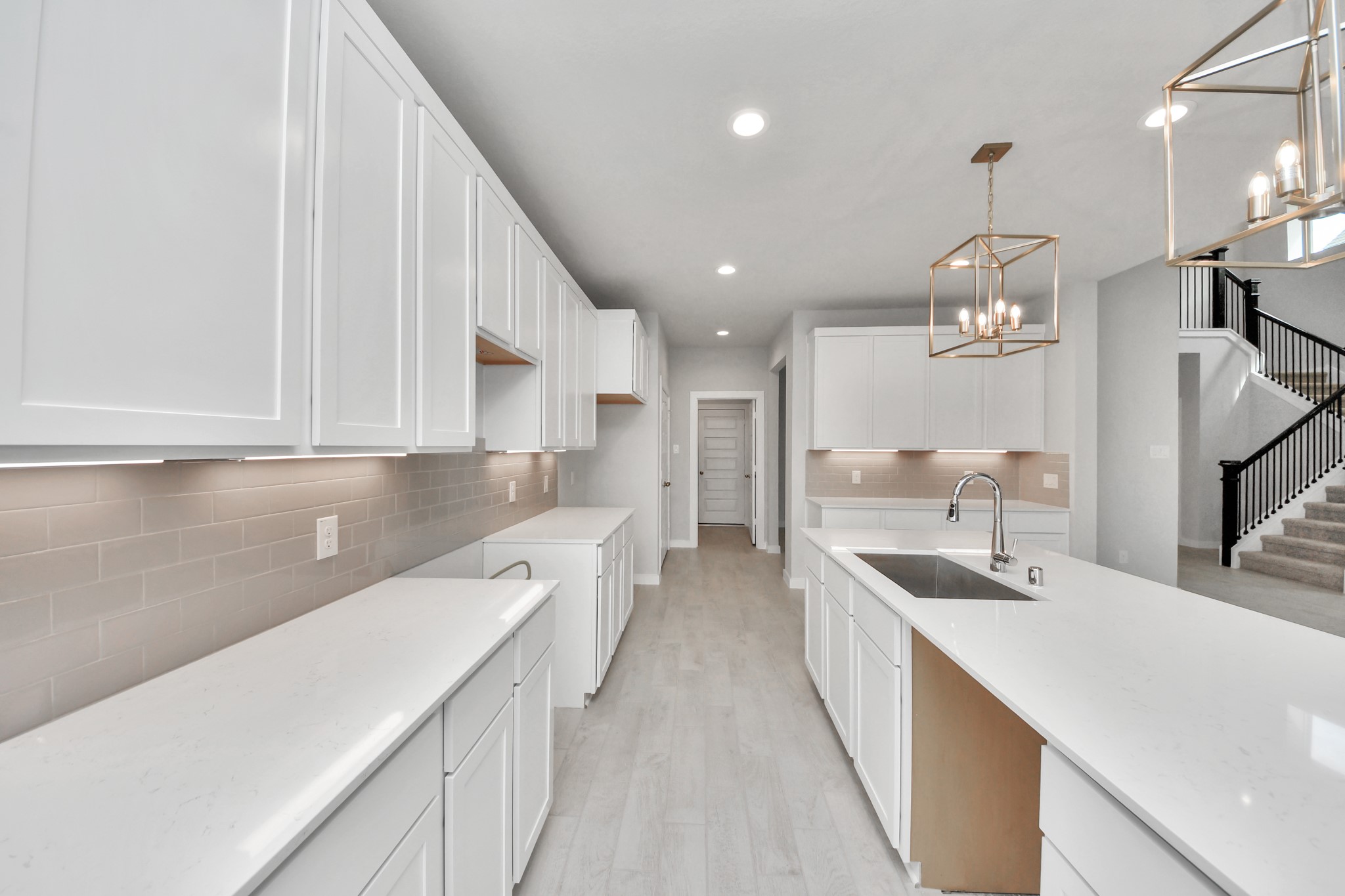 All of this overlooks your expansive family room, creating a perfect space for culinary delights and family gatherings. Sample photo of completed home with similar floor plan. Actual colors and selections may vary.