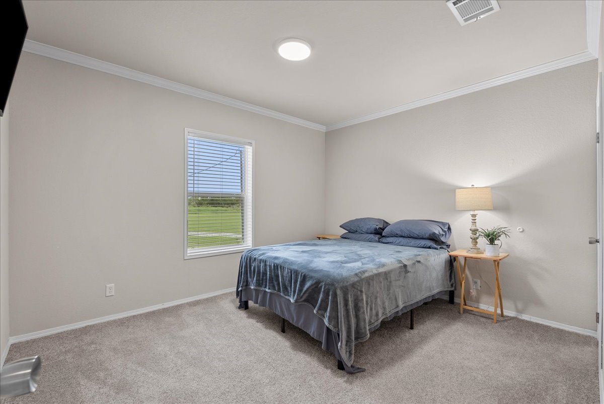 The third bedroom offers a lovely view of the backyard, creating a bright and peaceful space to enjoy