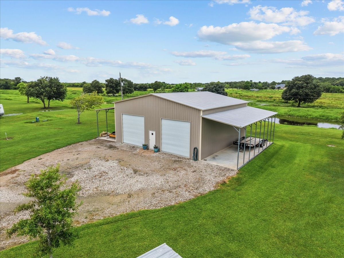 10x40 awnings on both sides provide excellent covered space for equipment, vehicles, trailers, or outdoor work areas