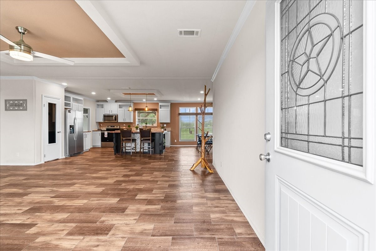 Step inside to a welcoming entry that flows into the spacious living room