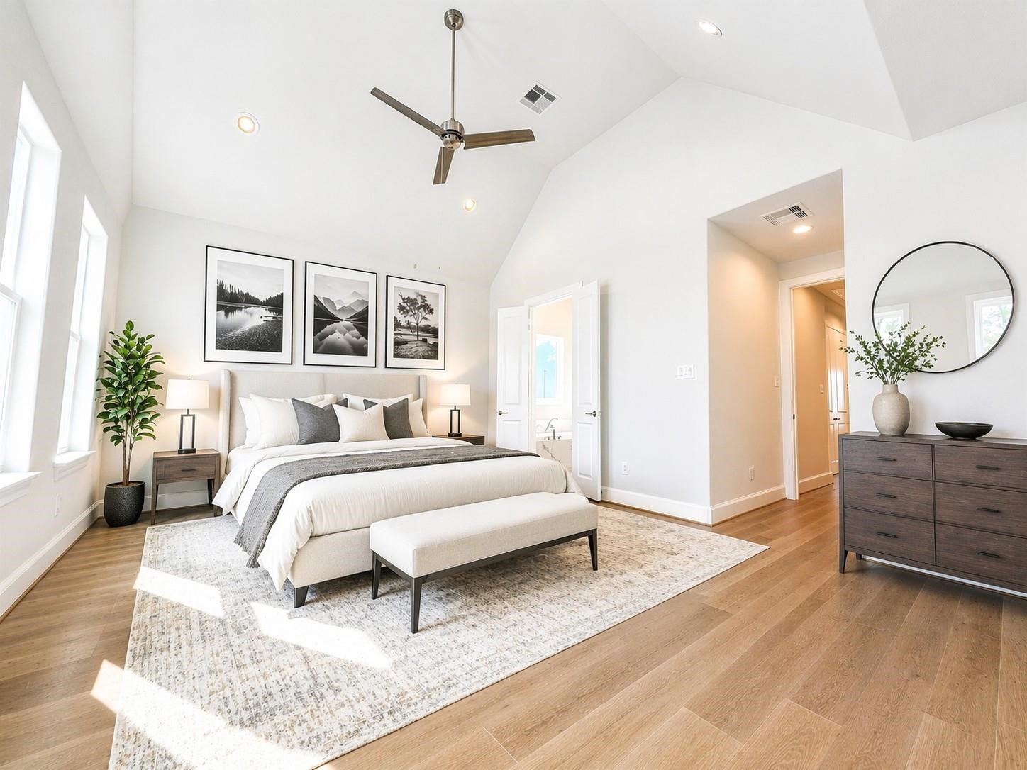 Primary suite bathed in natural light! Photo is from a previous build of similar plan.
