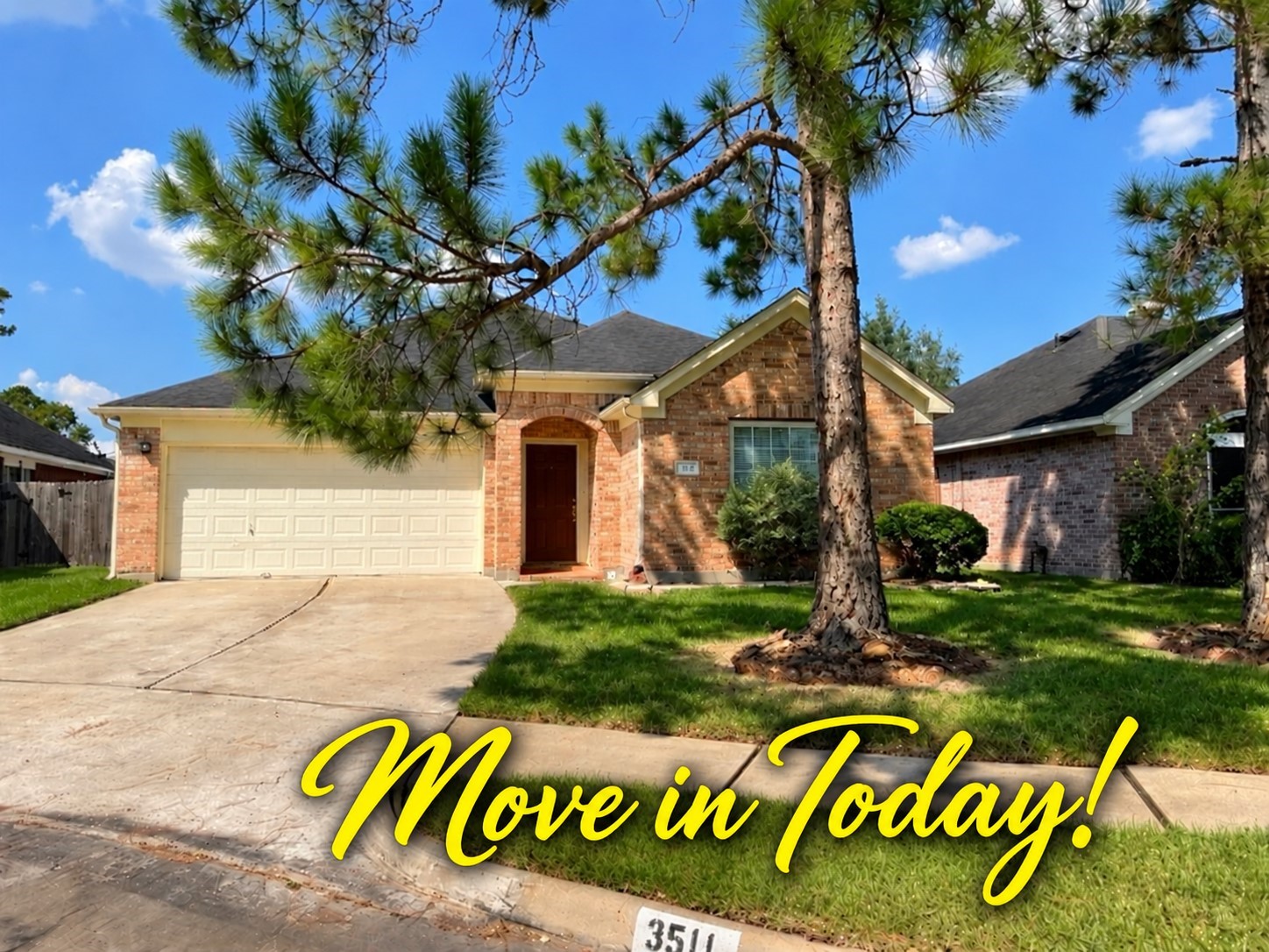 Charming brick home with a spacious two-car garage, nestled in a lush green lawn with mature trees lining the driveway. Cul-de-sac location!