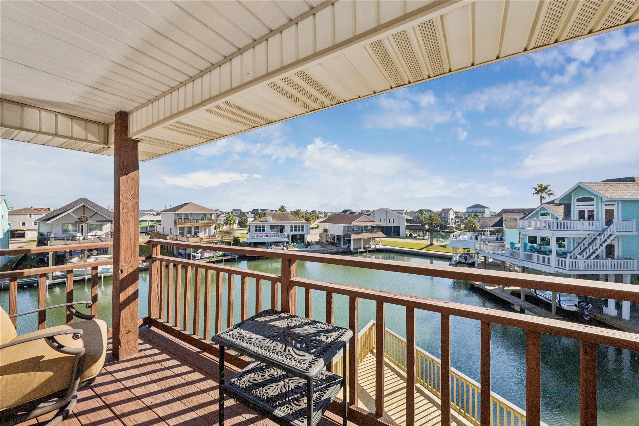 Step through French doors onto your private covered balcony, where sweeping sightlines stretch across the canals, with views extending all the way to Jones Bay. Unblocked by neighboring homes, it's perfectly positioned for watching the daily sunrise.