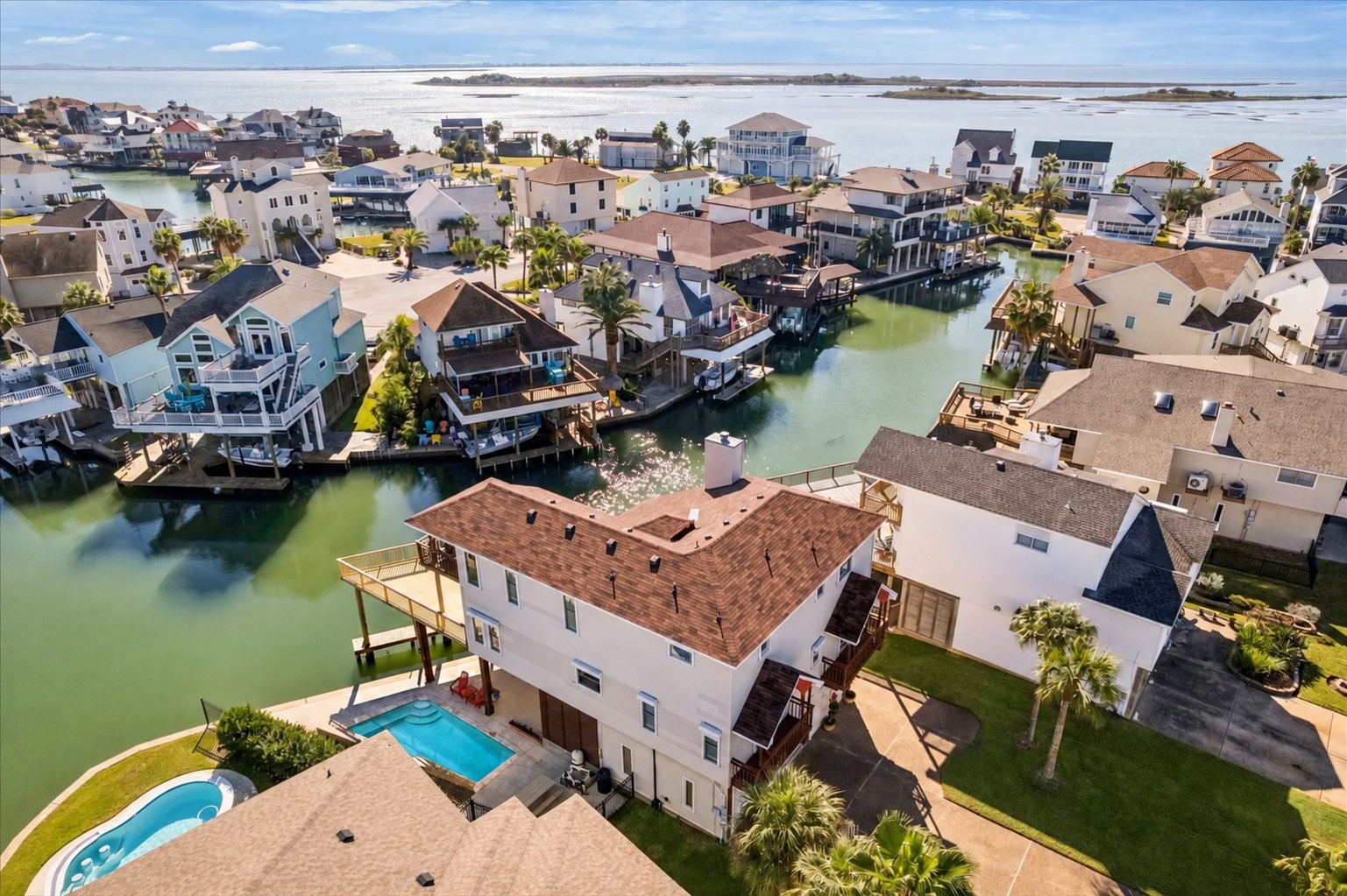 Island living where serene water views and tropical birdsongs make daily life more relaxed, carefree and fun.
