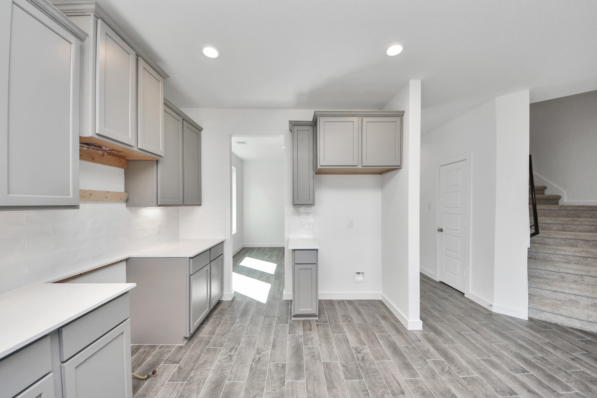 The extended counter area adds both practicality and style, making meal preparation a breeze. Every detail is thoughtfully designed to enhance the kitchen's functionality and aesthetic appeal. Sample photo of completed home with similar floor plan. Actual colors and selections may vary.