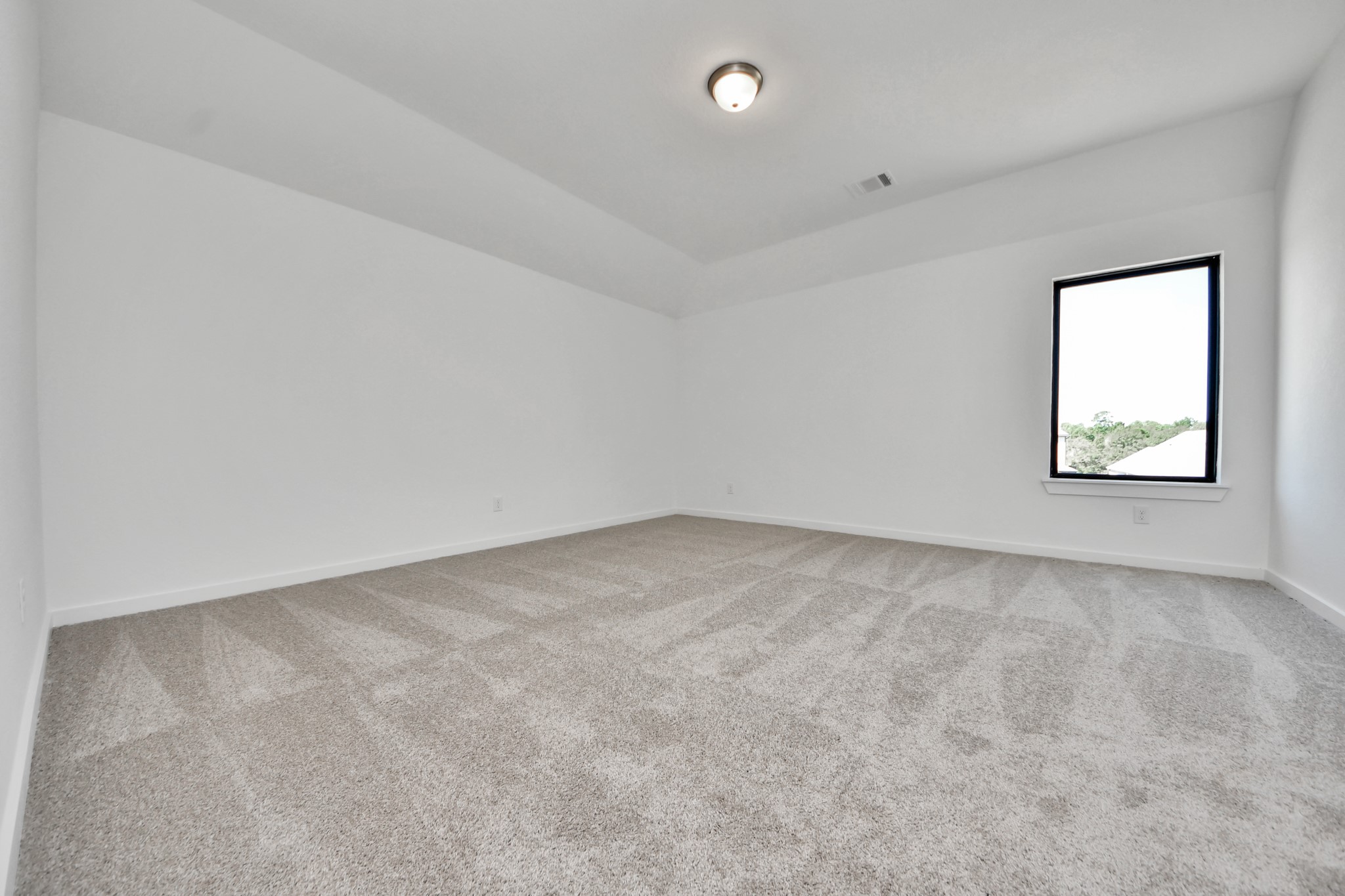 Ascend to relaxation in this fantastic game room! Ideal for both casual gatherings and adult gaming, it boasts plush carpet, lofty ceilings, custom paint, and ample windows for abundant natural light. Sample photo of completed home with similar floor plan. Actual colors and selections may vary.