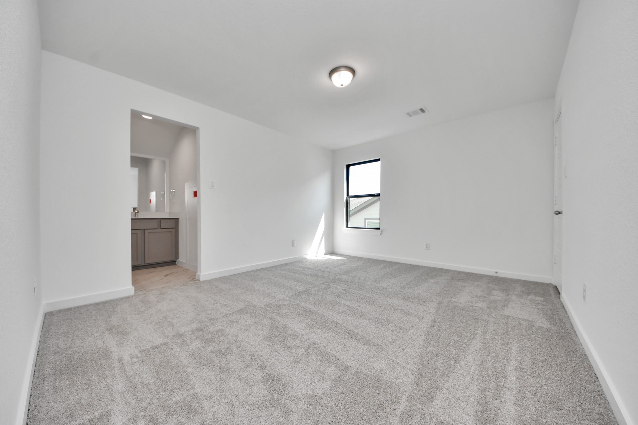 Generously sized secondary bedrooms featuring spacious closets, soft and inviting carpeting underfoot, large windows allowing plenty of natural light, and the added touch of privacy blinds for your personal retreat. Sample photo of completed home with similar floor plan. Actual colors and selections may vary.