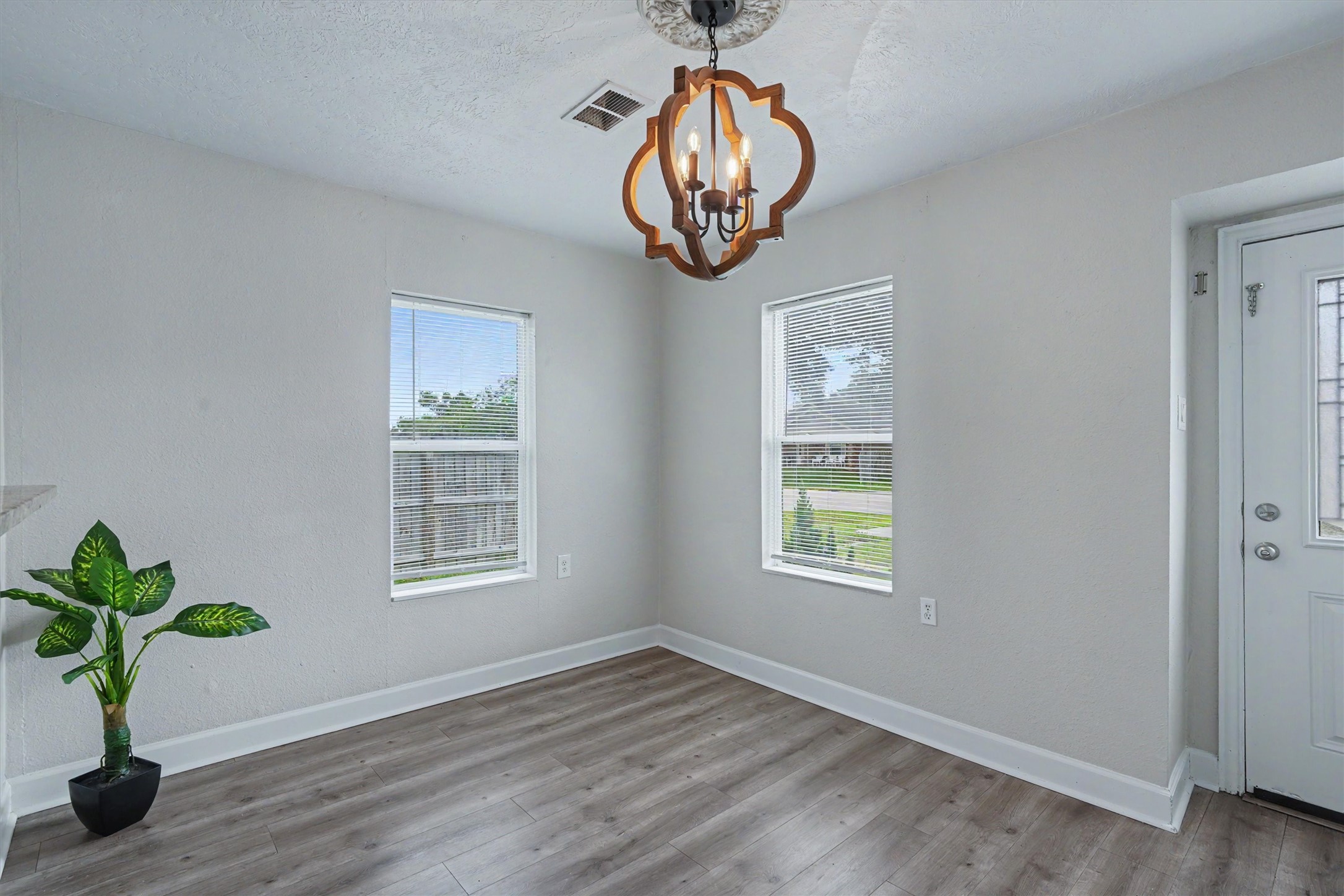 Light-filled flex space with two windowsideal for dining, a sitting area or home office.