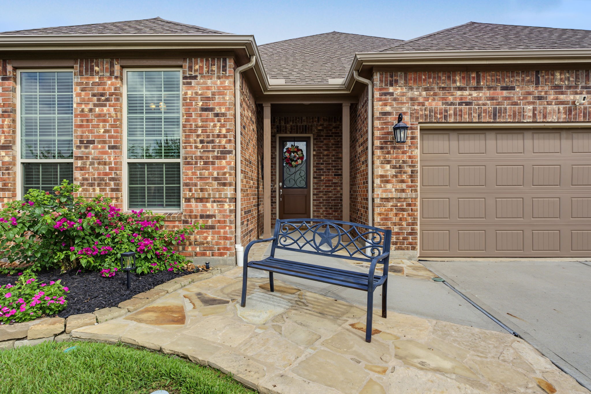 Stunning stone enhancements along the driveway Stunning stone enhancements along the driveway