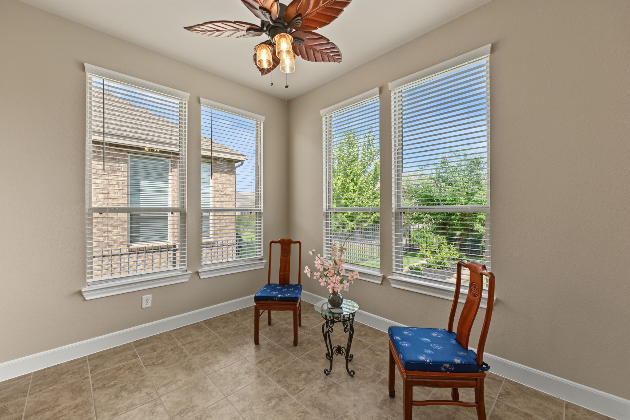The sunroom is an extra delightful bonus with great views of the peaceful backyard