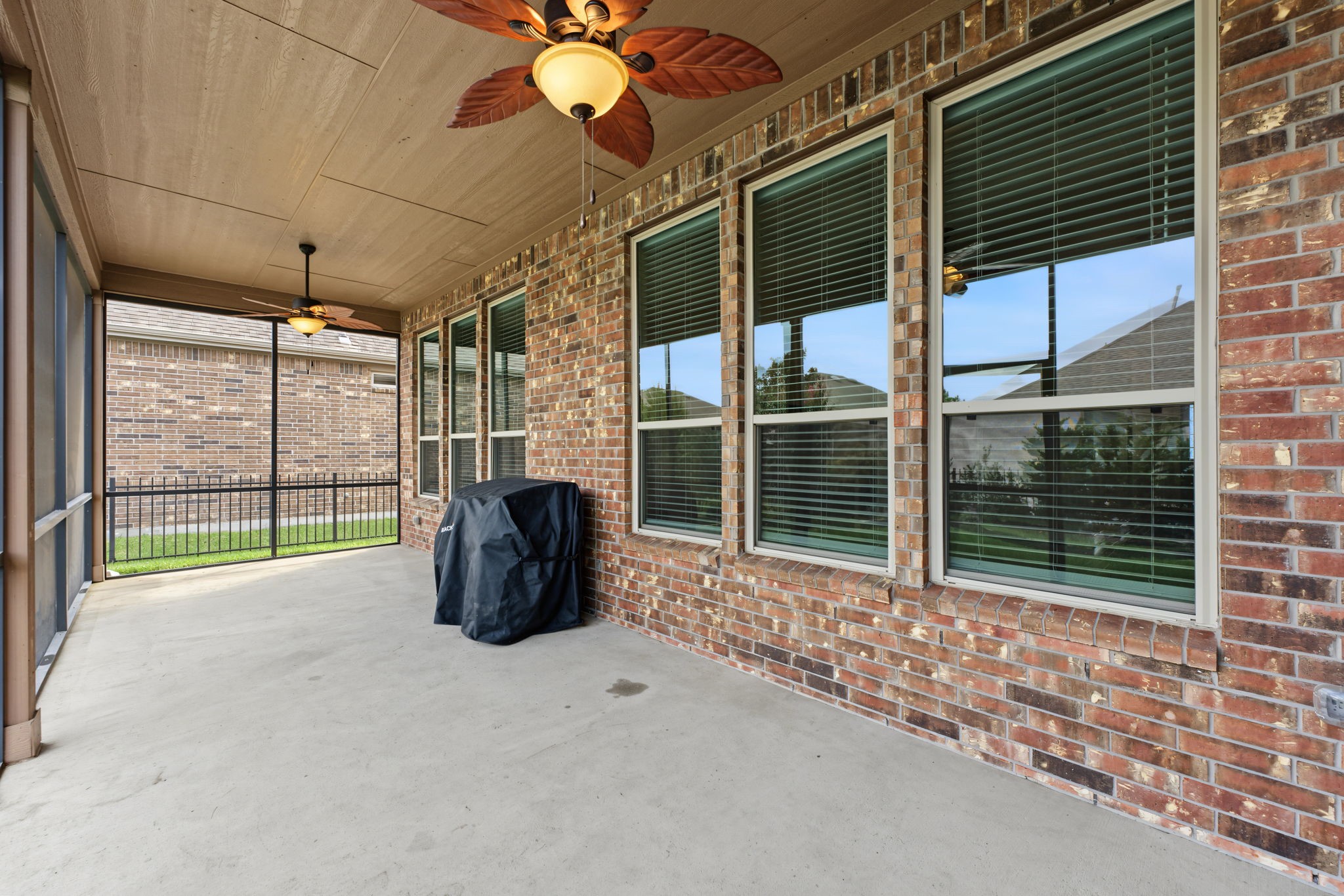 This screened in porch runs the entire length of the home.