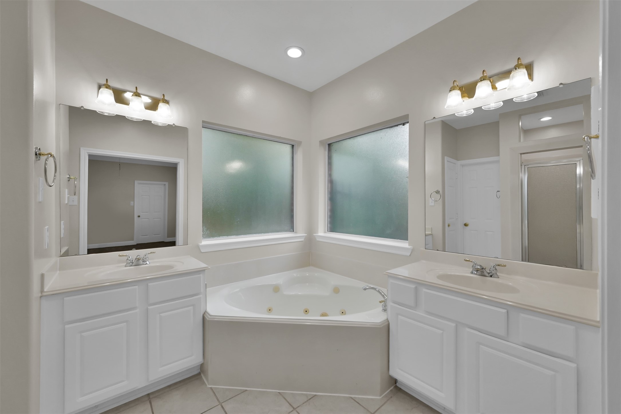 Primary Bath with double sinks and jetted tub.