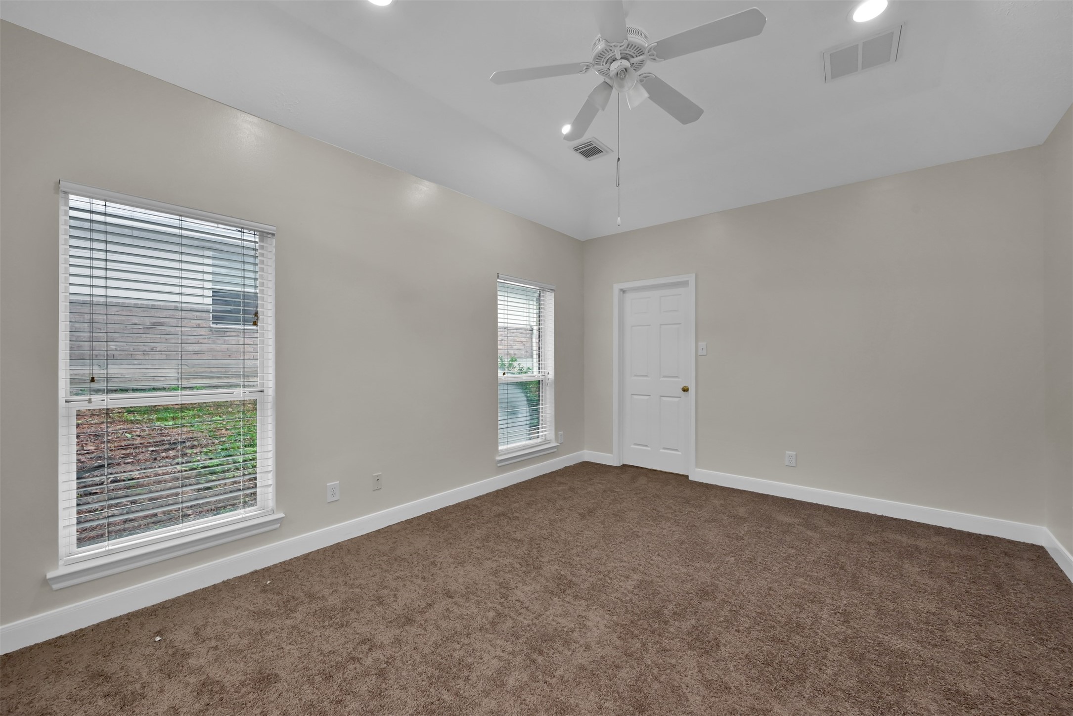 Primary Bedroom with walk in closet ahead.