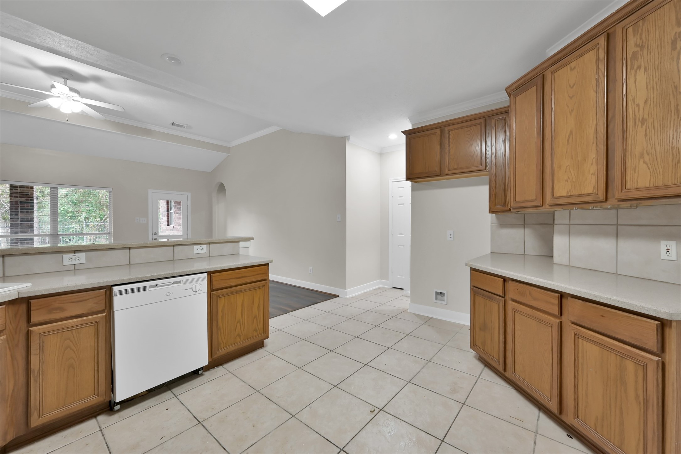 Kitchen while facing the Pantry and entrance to the Laundry room.