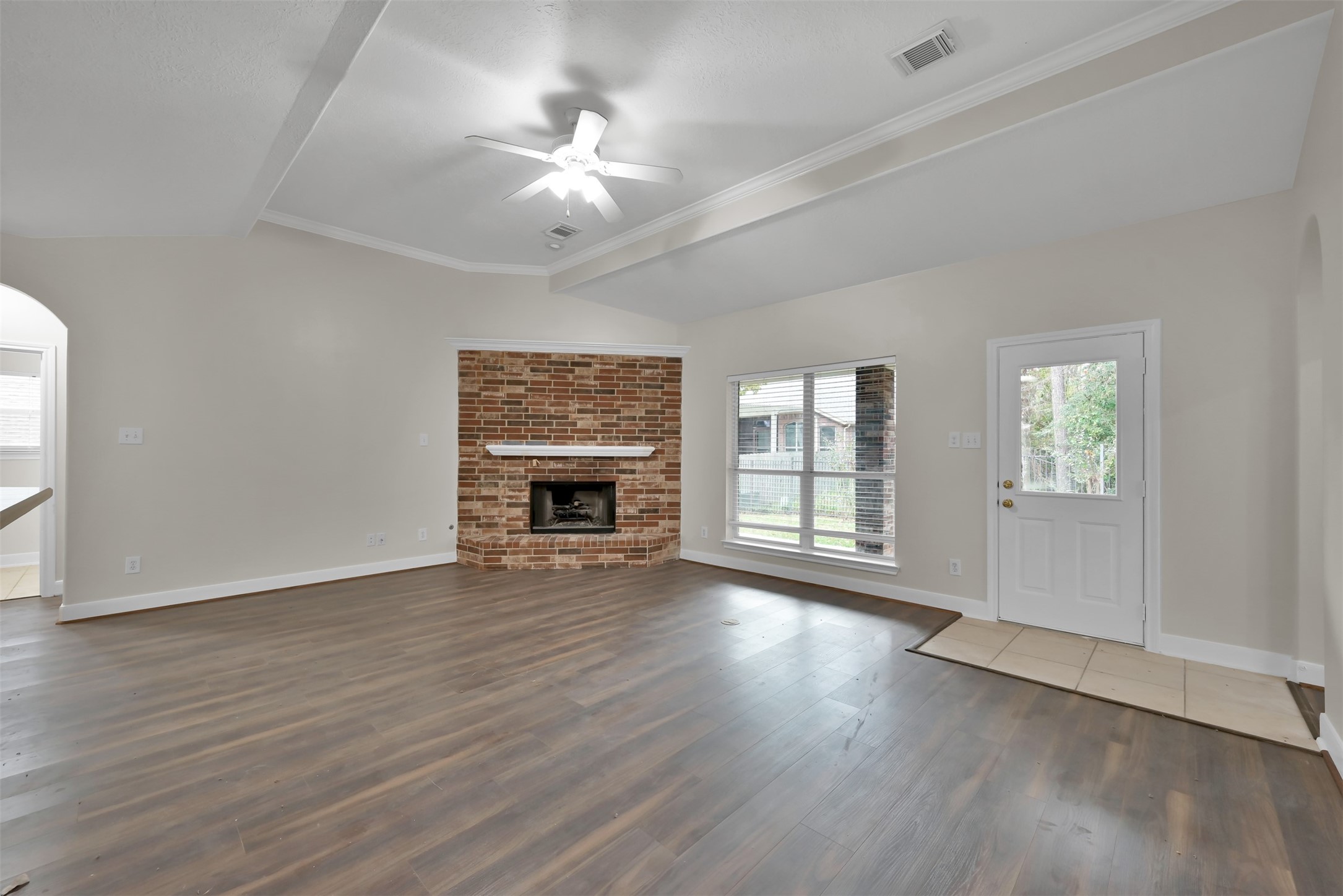 Living room with vaulted ceiling.