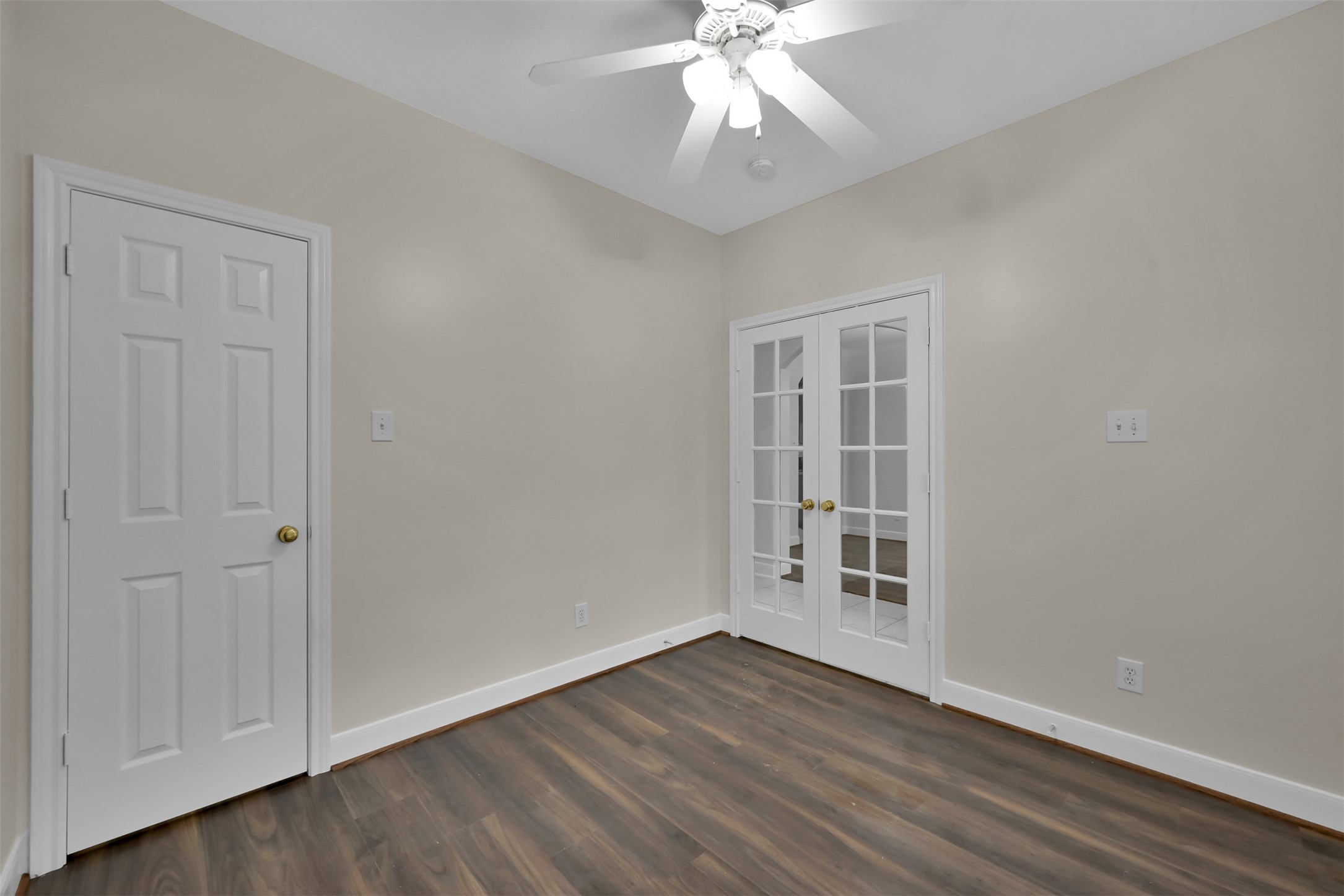 Office with closet and French doors.