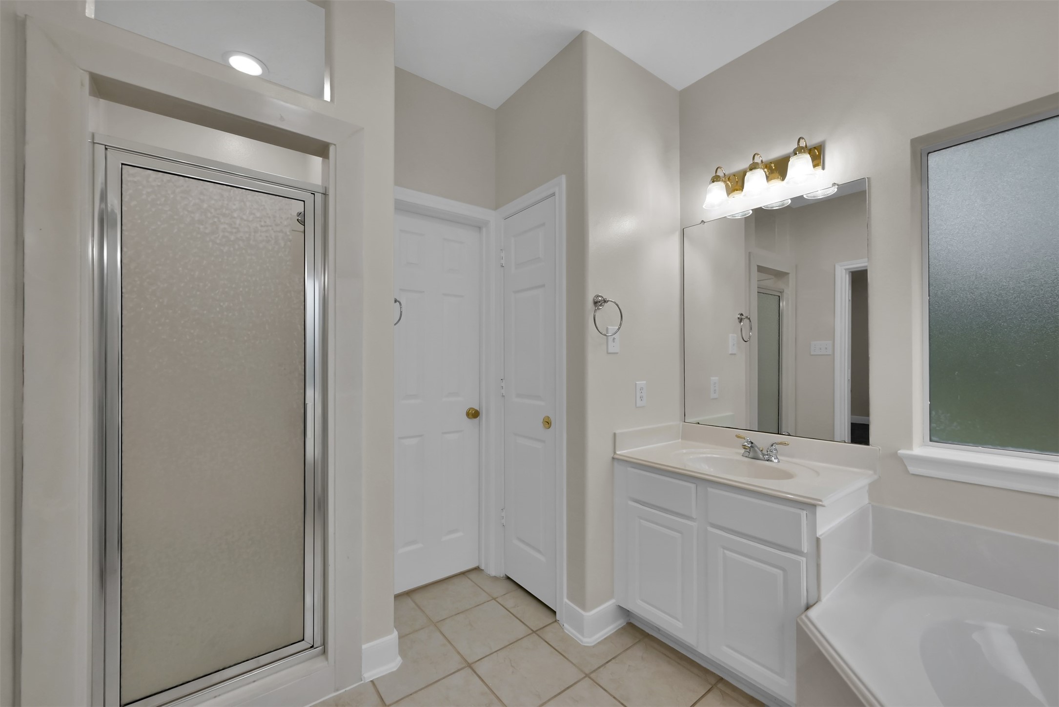 Primary Bath with walk in shower.