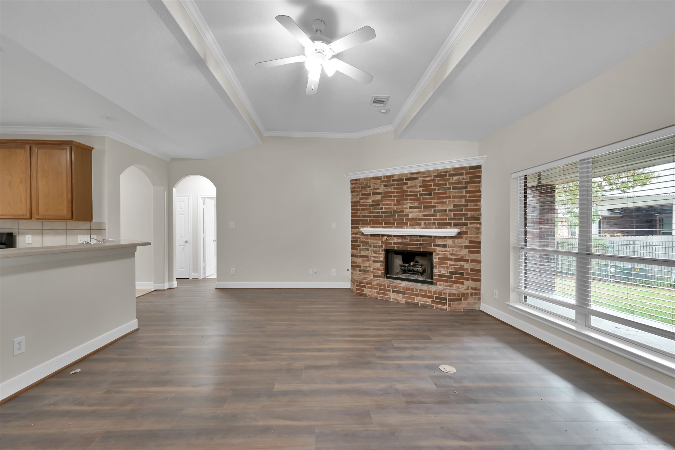 Living room with kitchen to your left. and 2 bedrooms and a bath straight ahead.