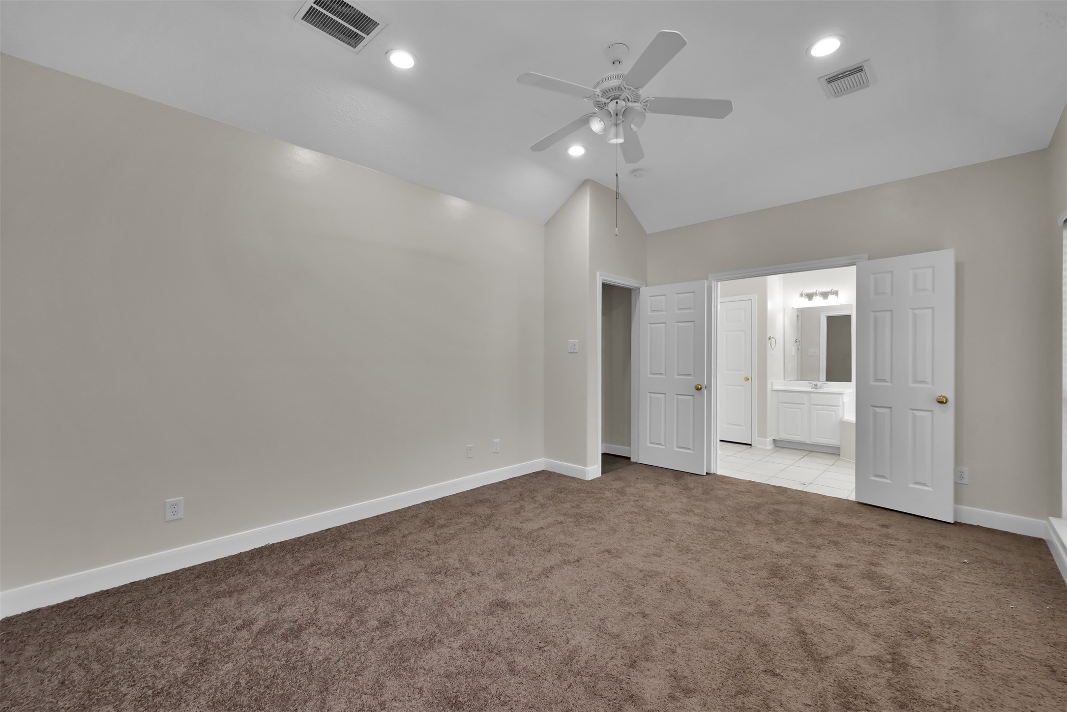 Primary Bedroom, ahead is the entrance to the Living room and the Primary Bath.