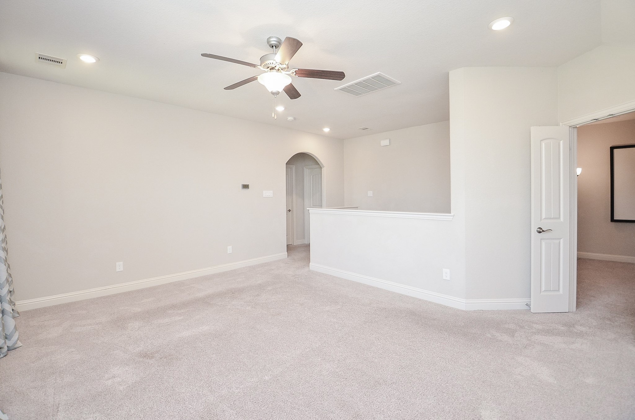 Spacious upstairs gameroom, perfect for use as a dedicated kids' playroom or a versatile entertainment space for guests!