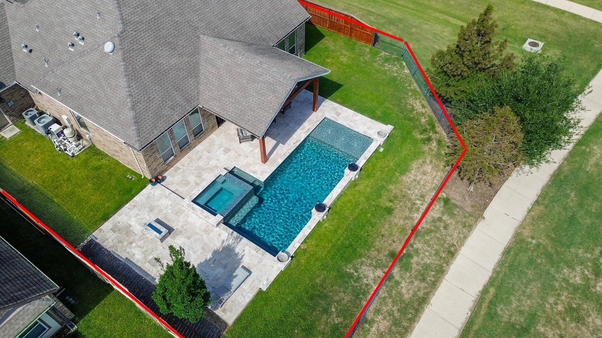 Aerial view showcasing the spacious lot and home exterior!