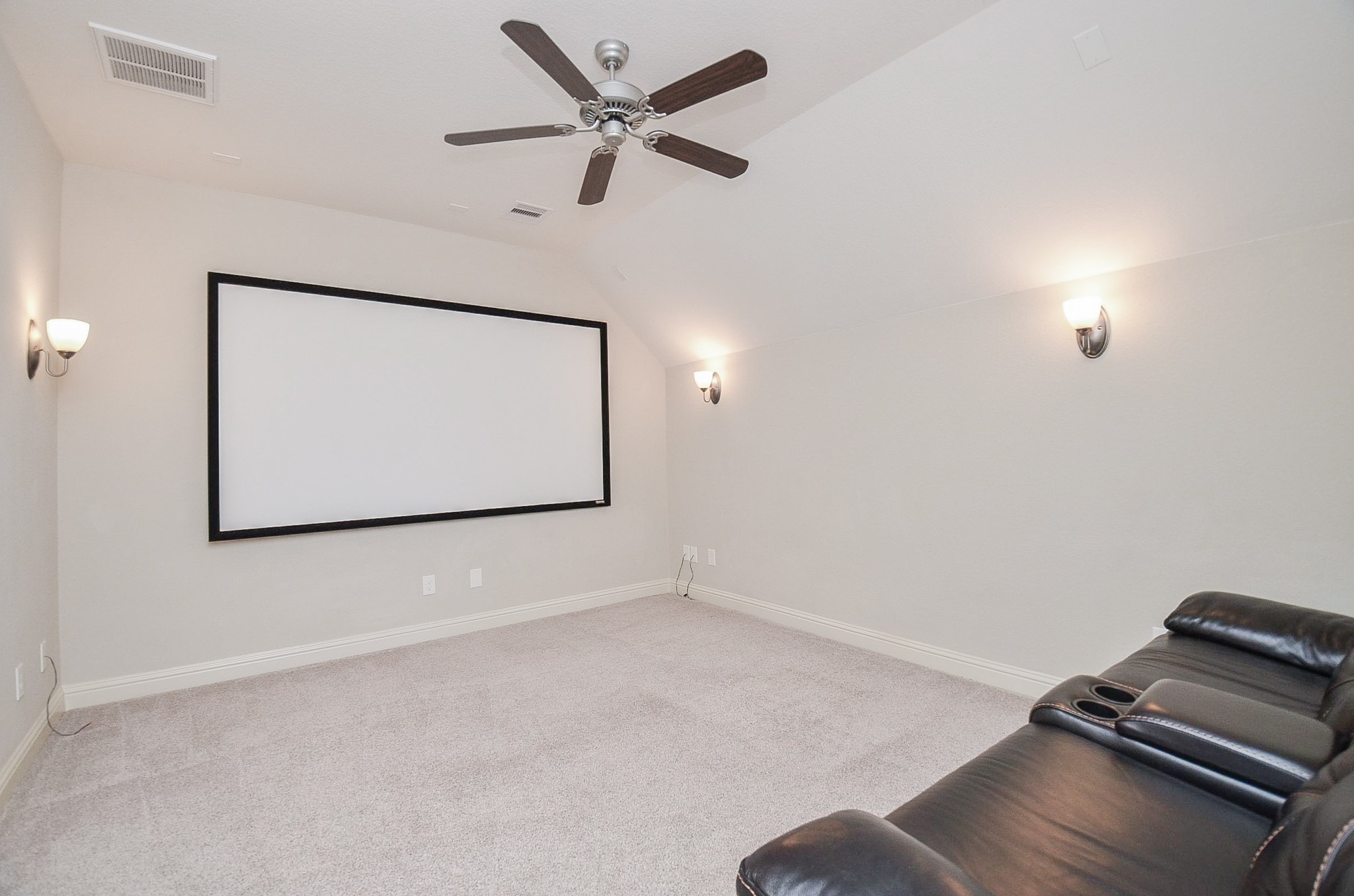 Spacious media room perfect for hosting movie nights!