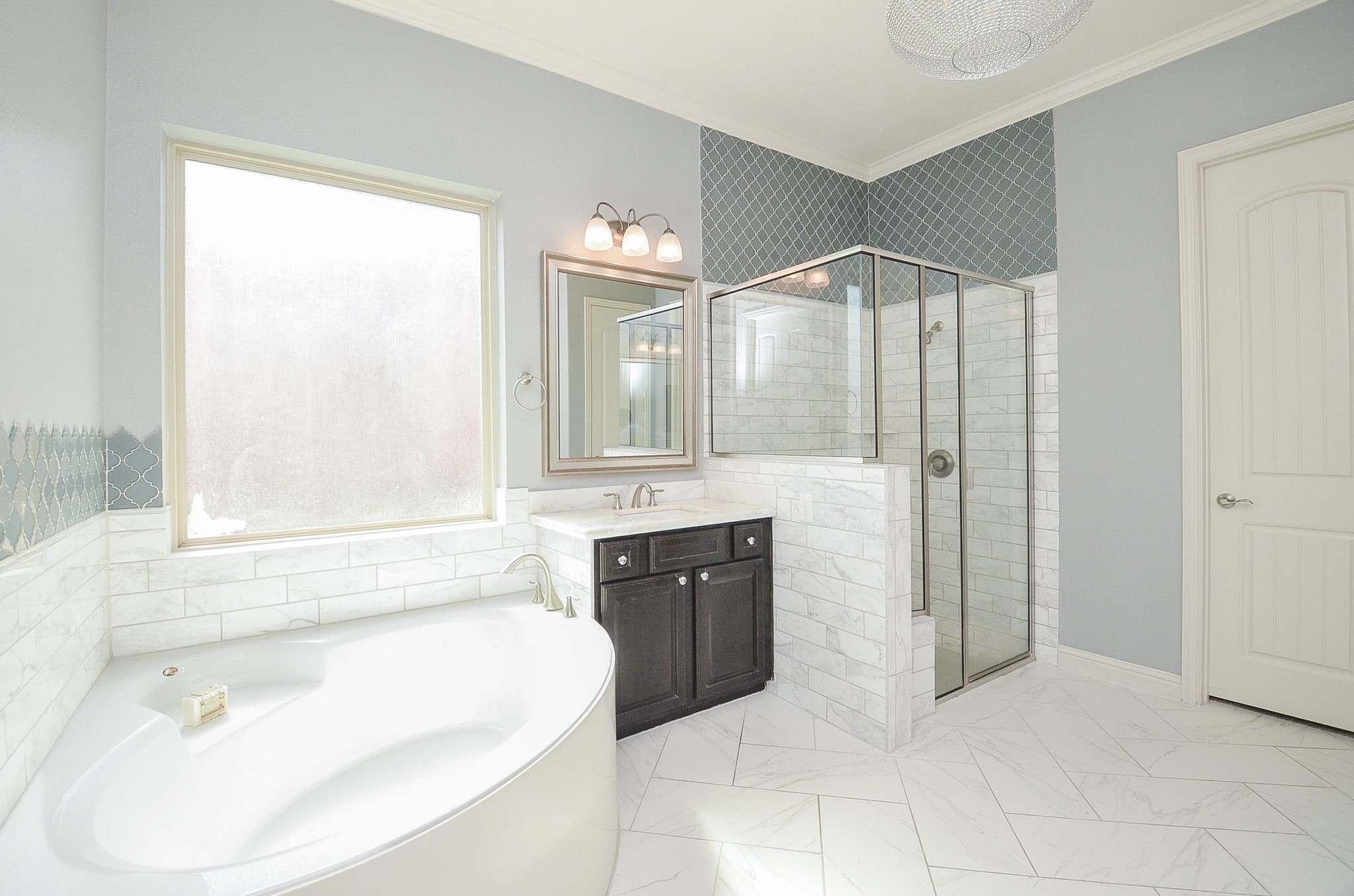 Spacious master bathroom featuring a separate soaking tub and walk-in shower!