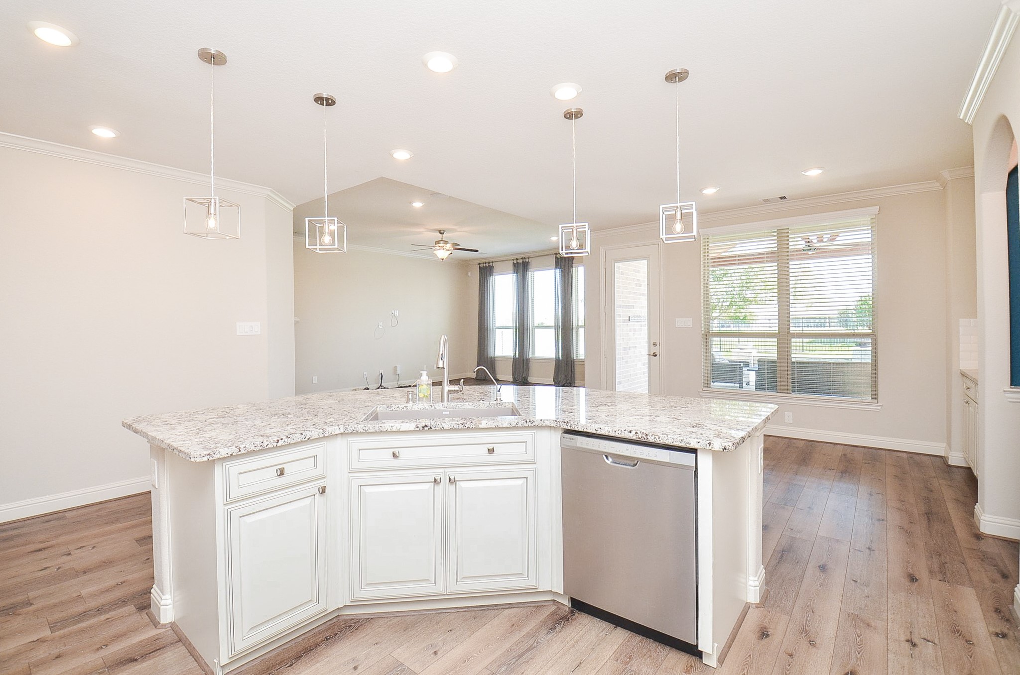 Large, spacious kitchen featuring extensive cabinet storage and abundant counter space!