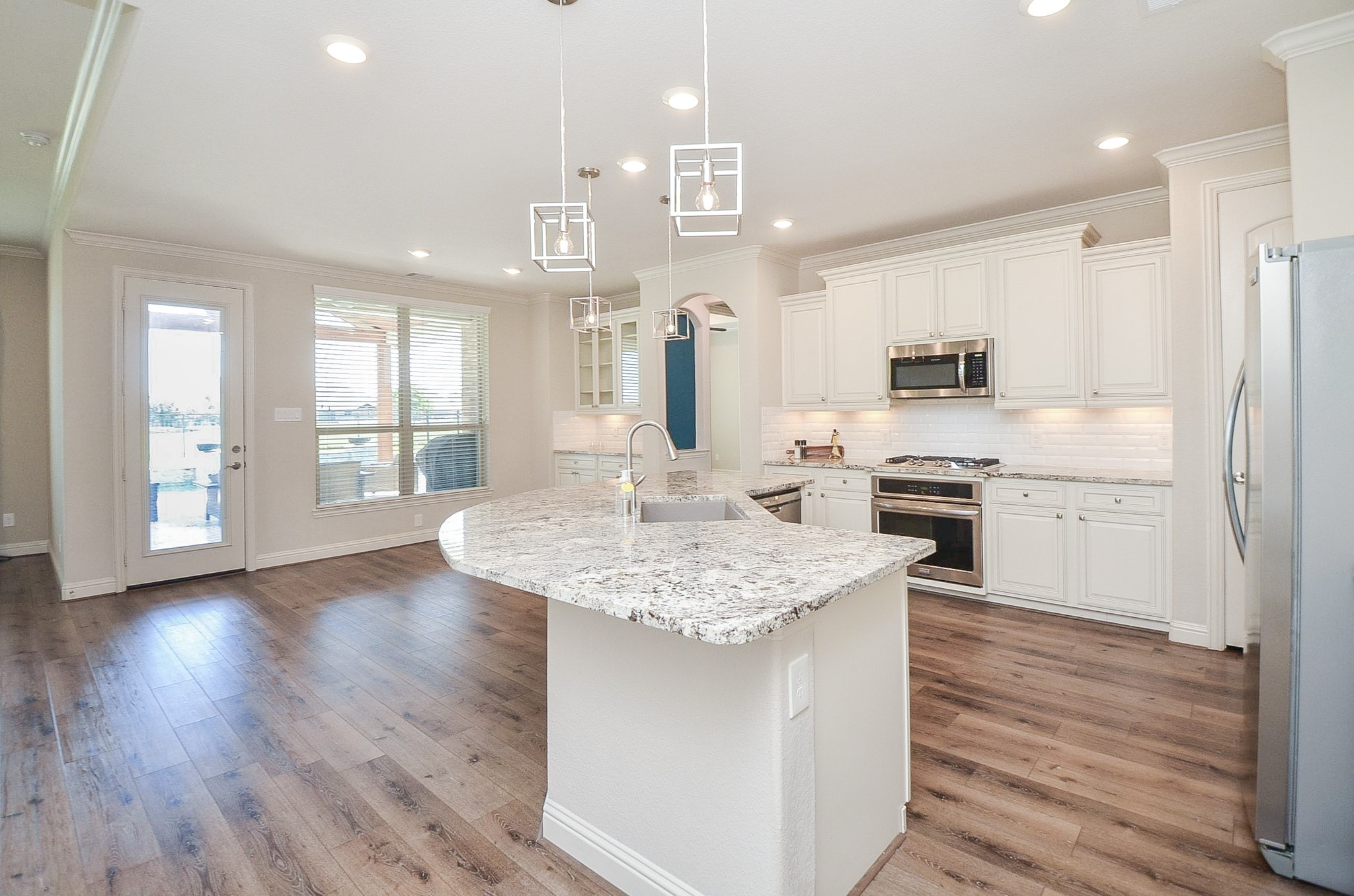 This property features an inviting open floor plan with a breakfast bar that flows seamlessly into the living room!