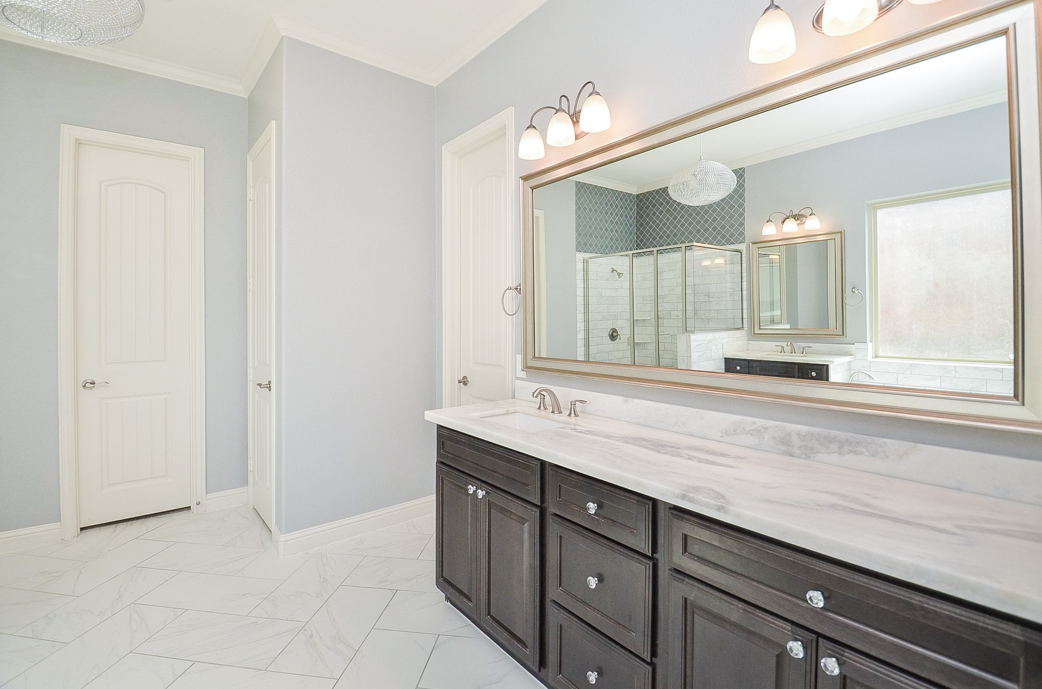 Double vanity with custom cabinetry in the primary bathroom!