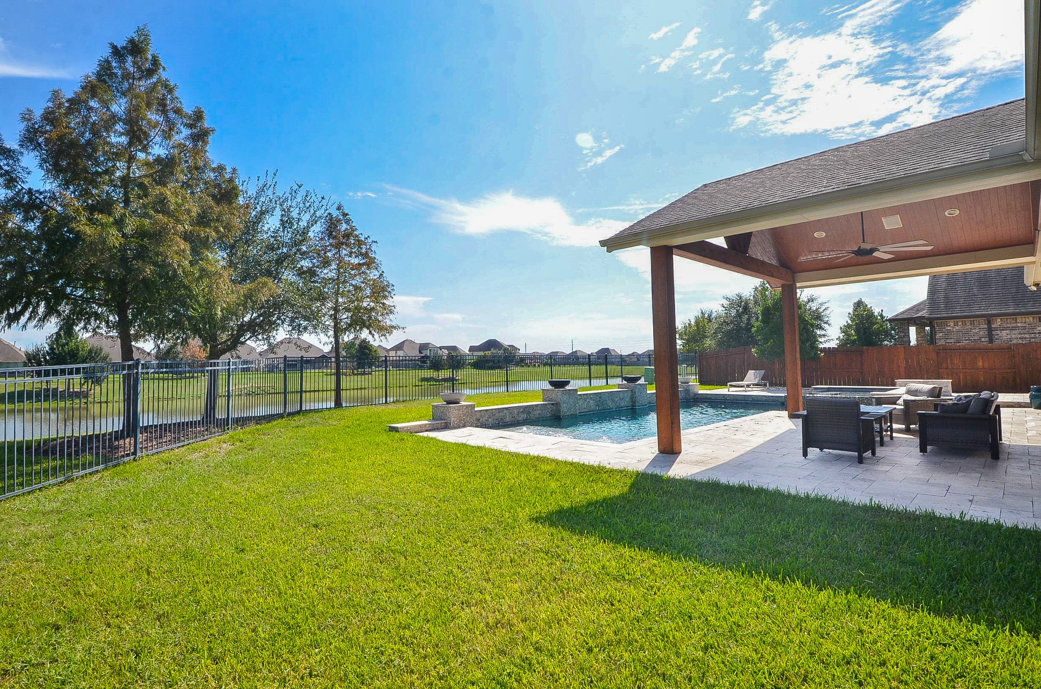This spacious backyard features expansive green space, perfect for outdoor recreation and family gatherings!