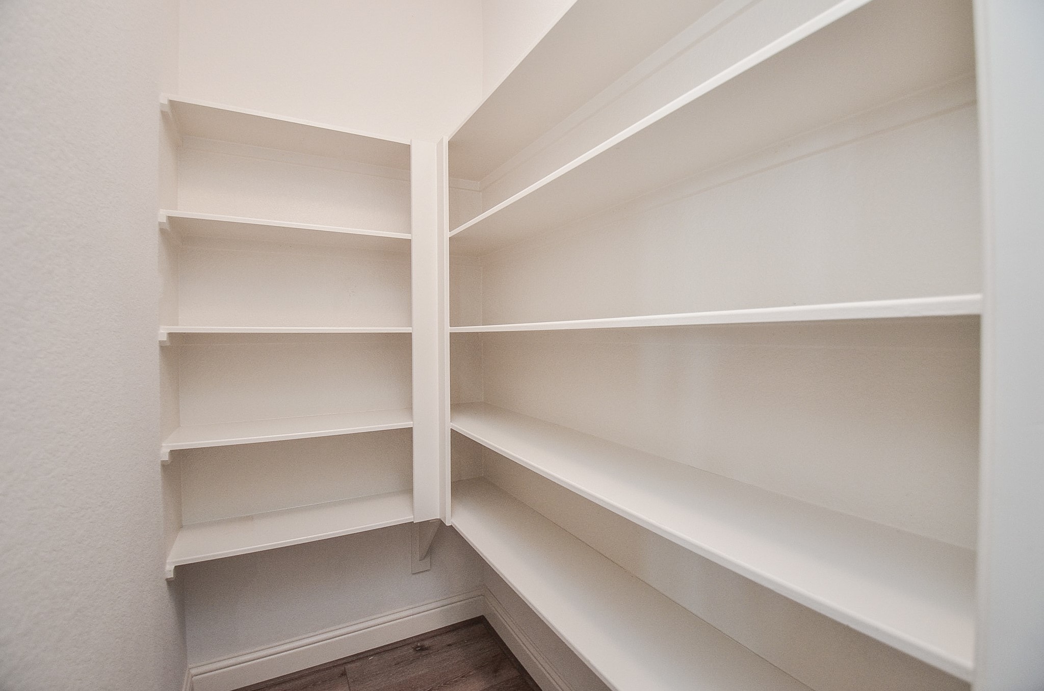 Walk-in pantry featuring extensive storage space!