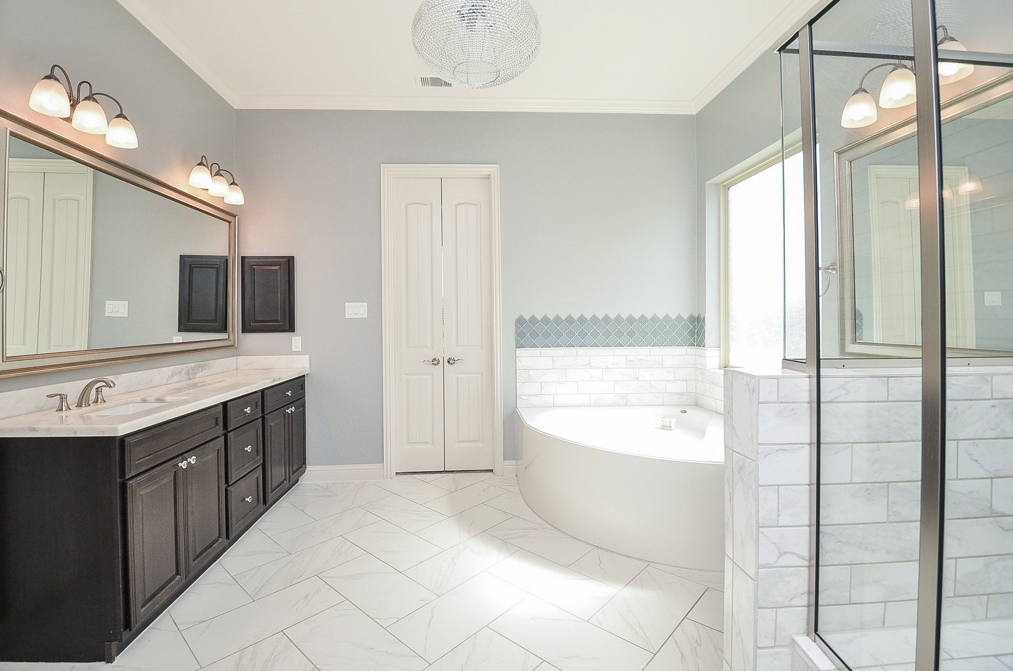 Features a spacious master bathroom with a separate soaking tub and walk-in shower!