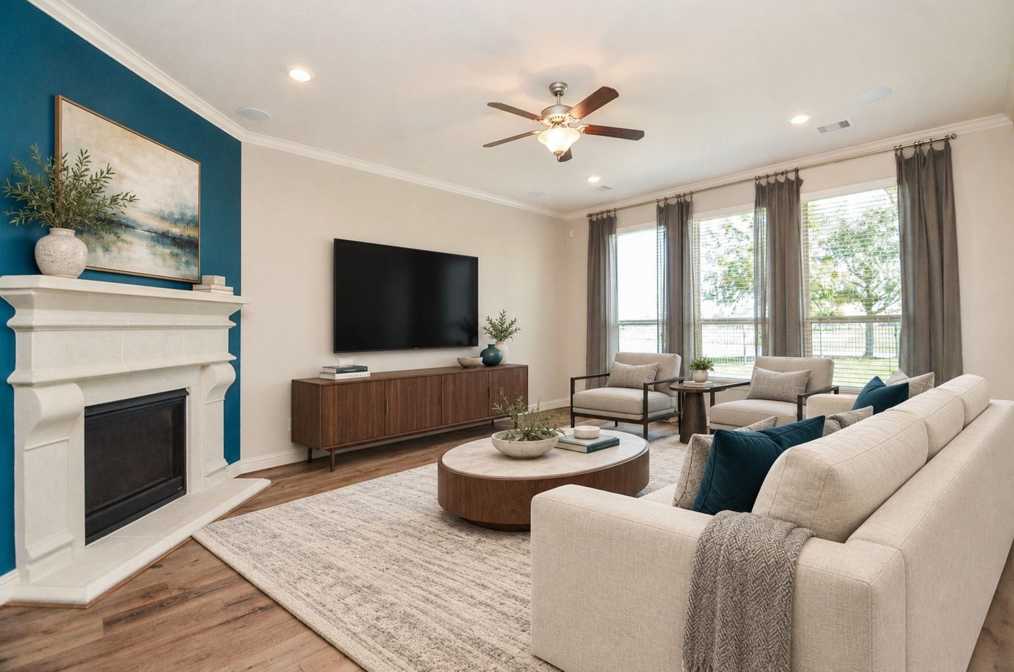 Virtually staged living room featuring abundant natural light and ample space for large furniture arrangements!