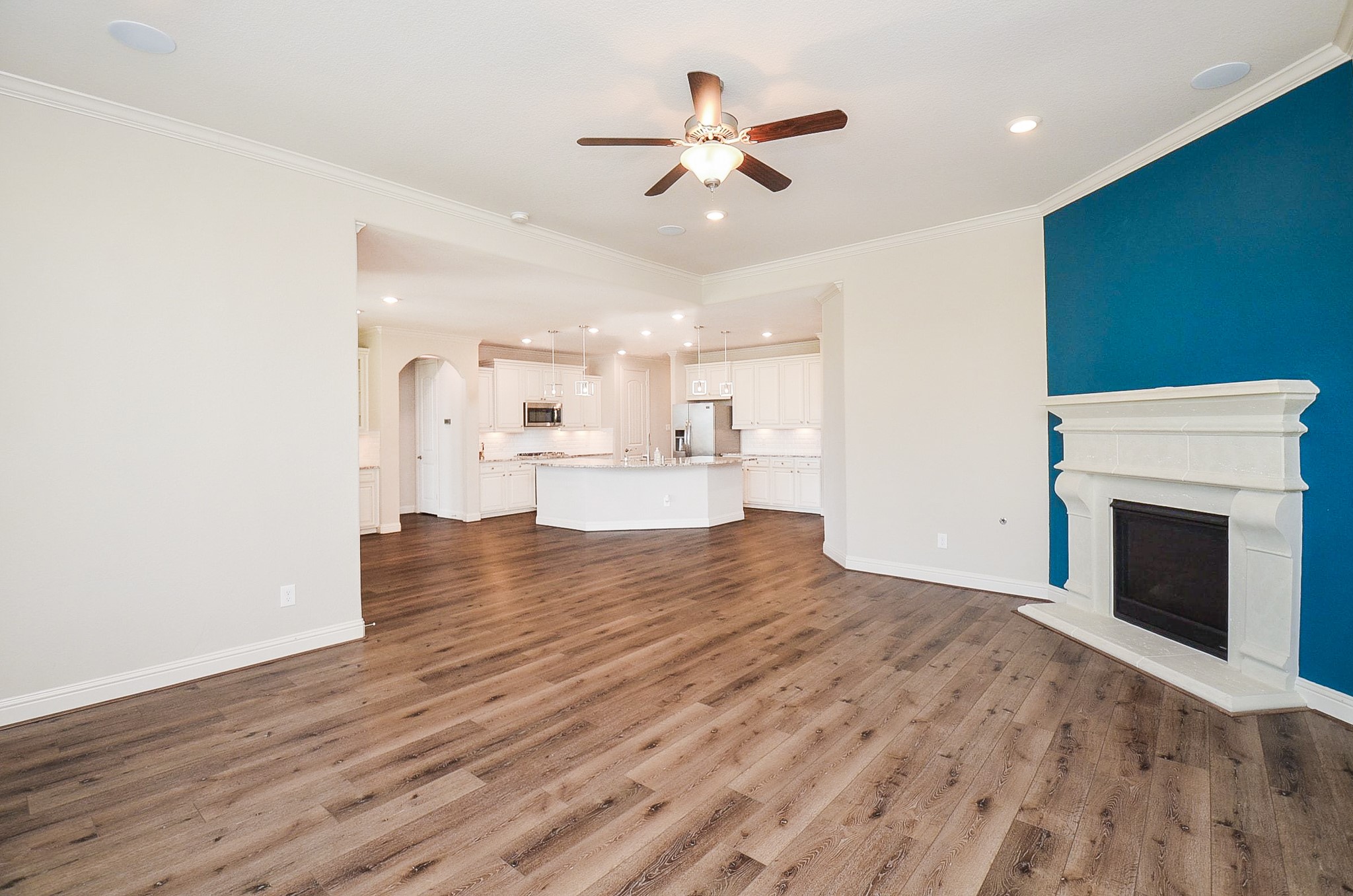 The possibilities are limitless in this expansive living room, which features a stunning stone fireplace!