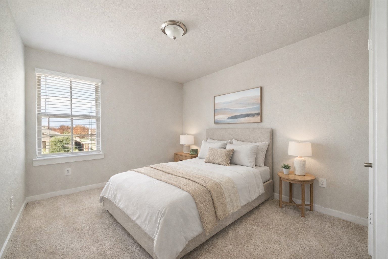 Comfortable and well sized, this bedroom offers a quiet retreat with natural light and a neutral palette. The simple design supports a variety of uses, from guest accommodations to a dedicated workspace. *Virtually Staged*