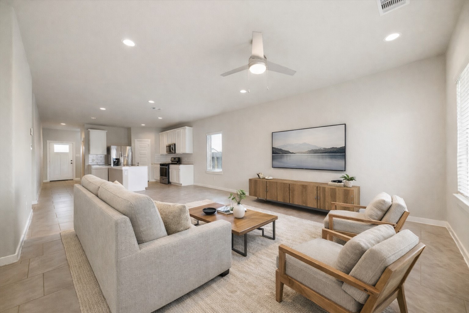 Large-format tile flooring continues throughout the main level, enhancing durability while maintaining a cohesive, modern aesthetic. *Virtually Staged*