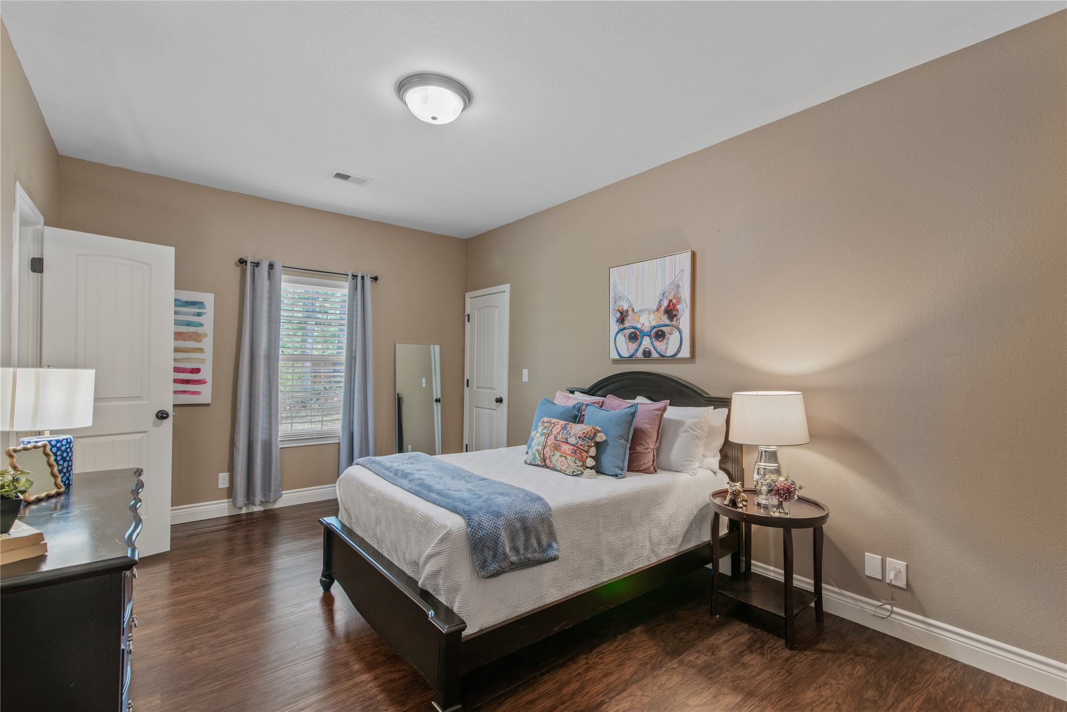 Spacious secondary bedroom featuring a walk-in closet and direct access to a shared Jack-and-Jill bathroom.