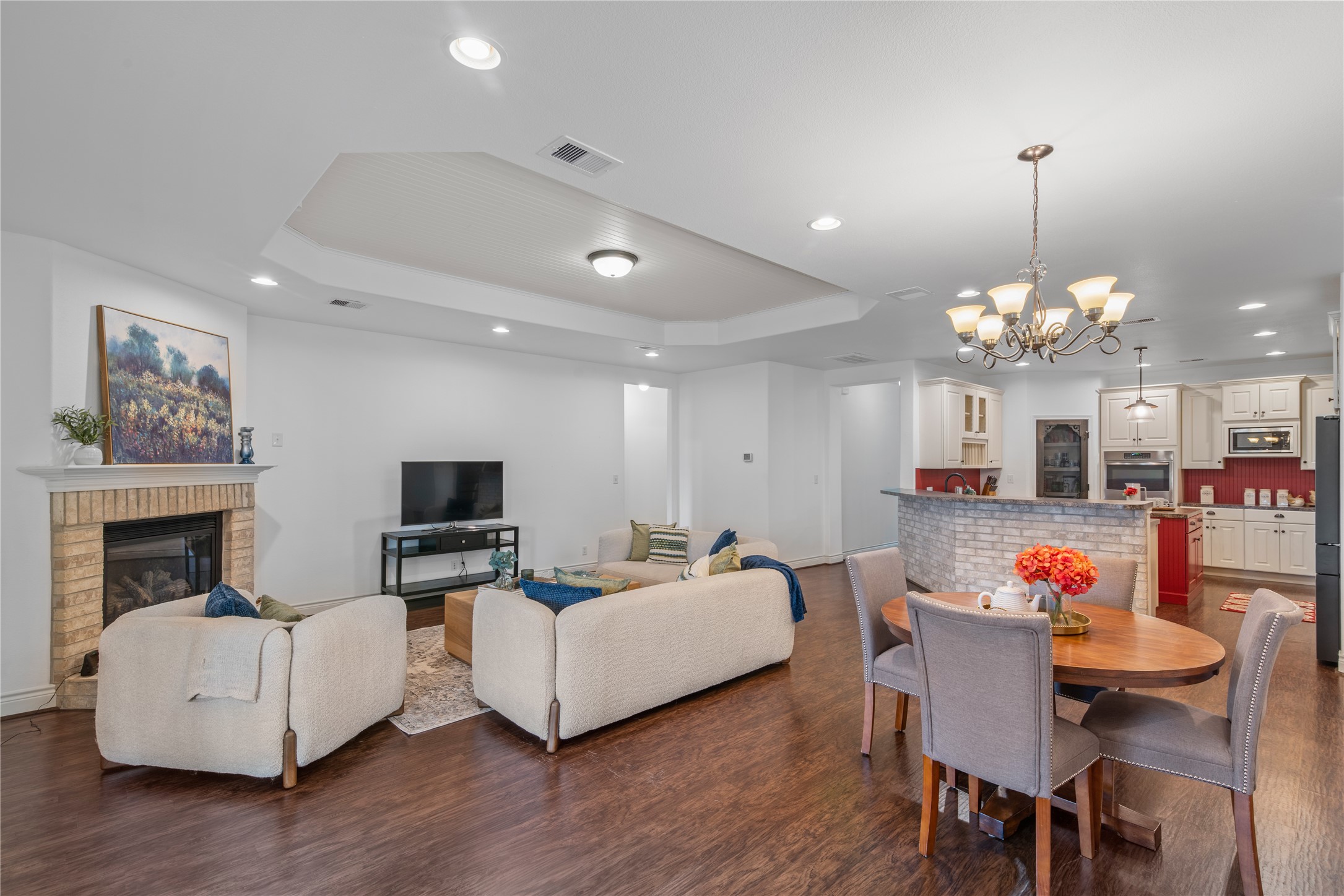 The kitchen overlooks the breakfast area and family room, keeping everyone connected during meal preparation and gatherings.