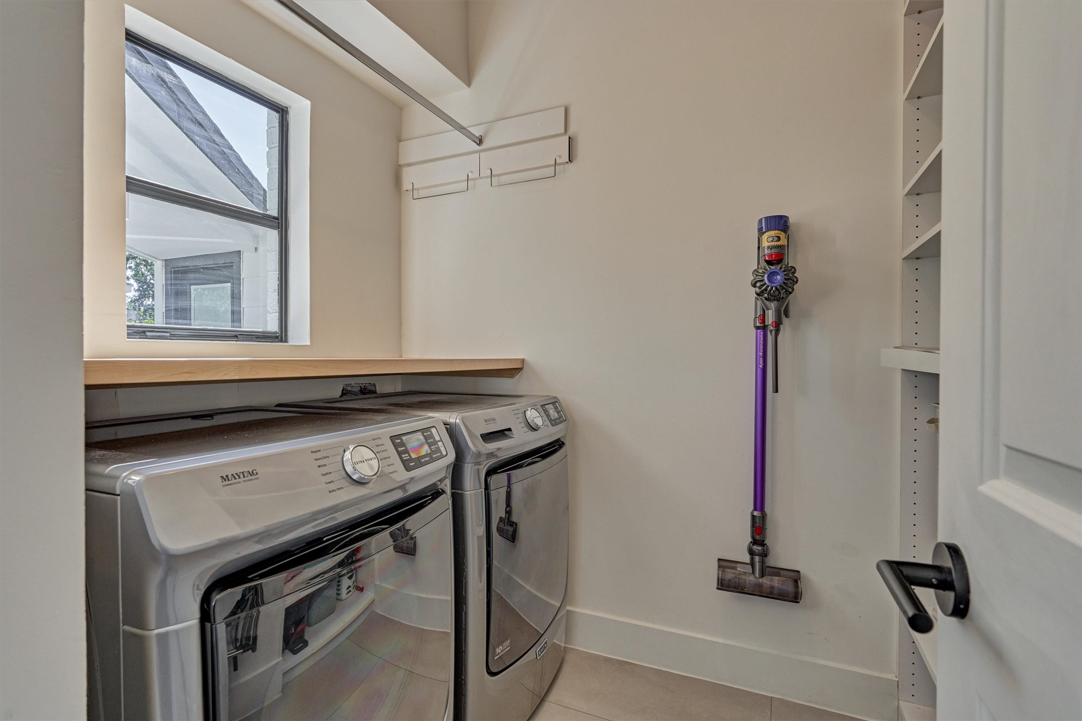 Remodeled laundry room with abundant storage options and folding space!