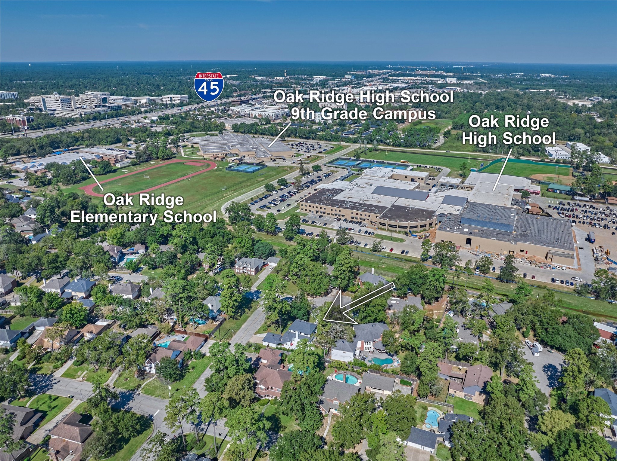 Aerial photo showcases proximity to nearby Oak Ridge schools.