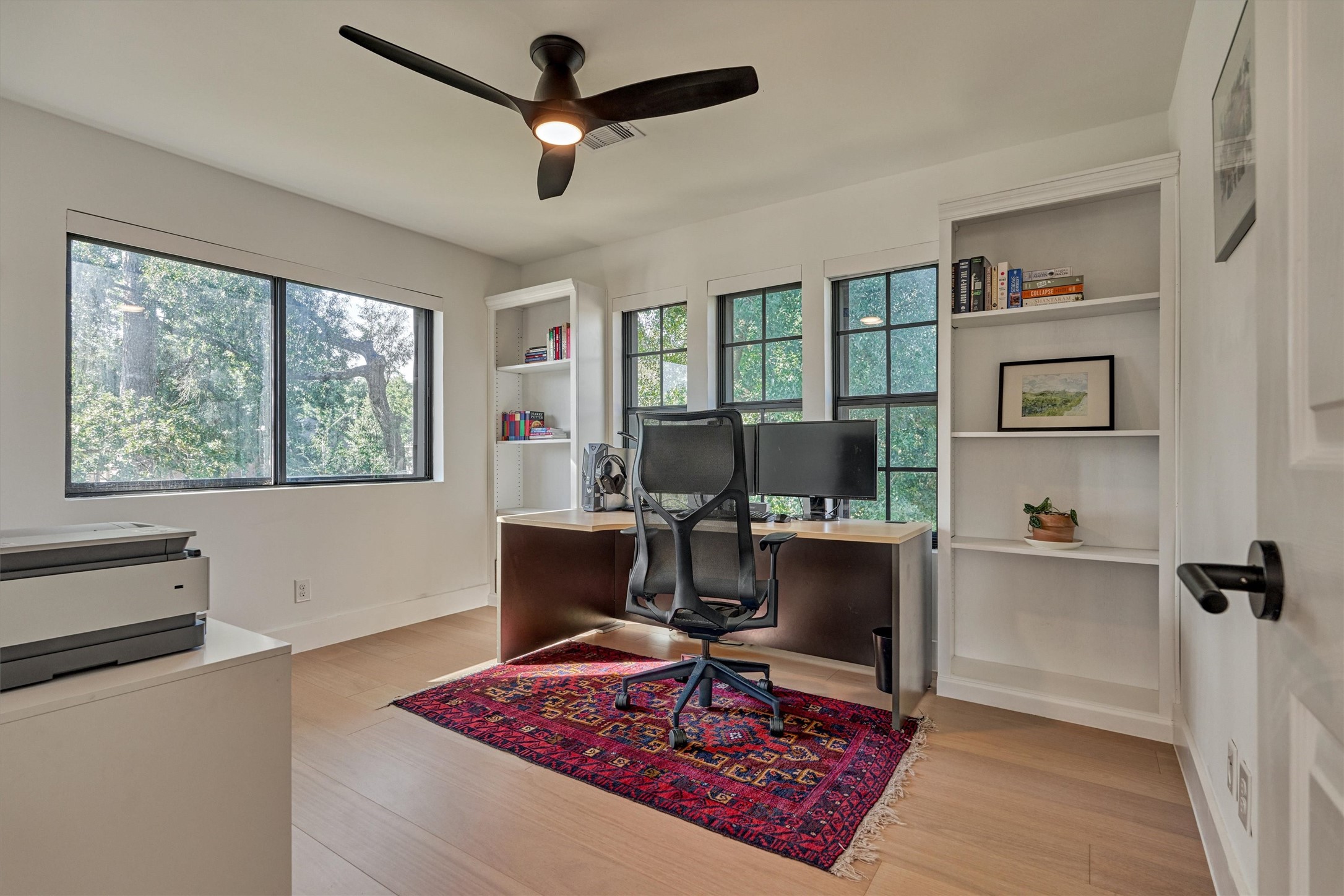 Bedroom 4 (optional office) features built-in bookshelves and tree top views!