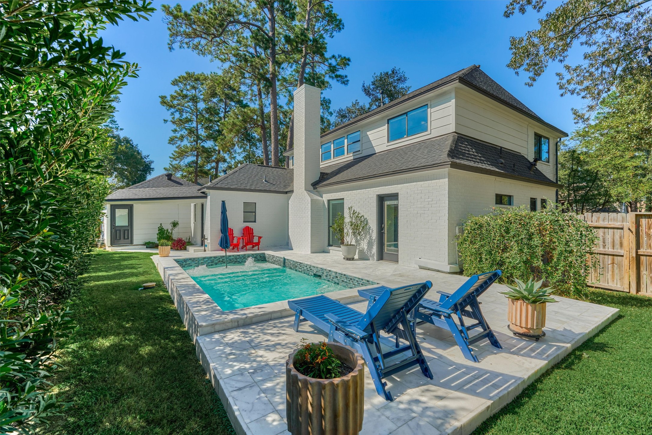 Built in 2024, this heated, resort-style pool with Travertine decking surround is the perfect spot to relax!