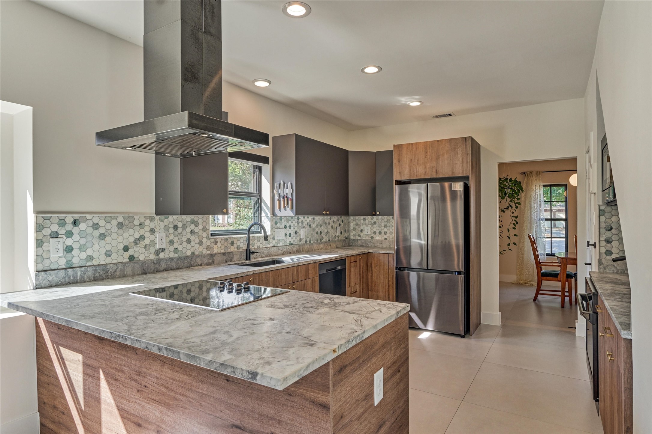 Kitchen opens to dining room for ease of entertaining.