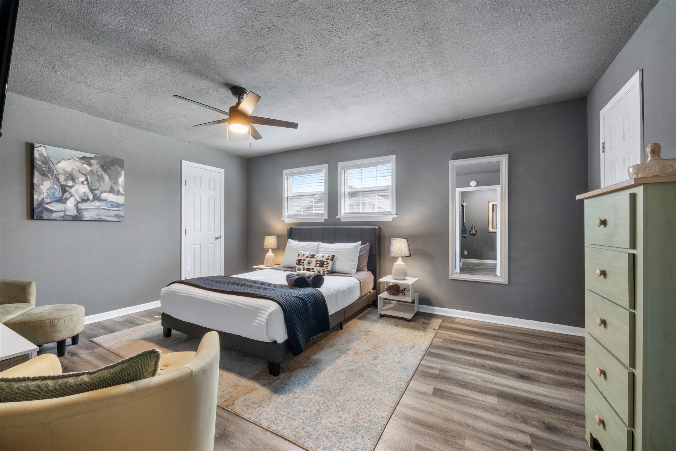 Spacious primary bedroom with sitting area.