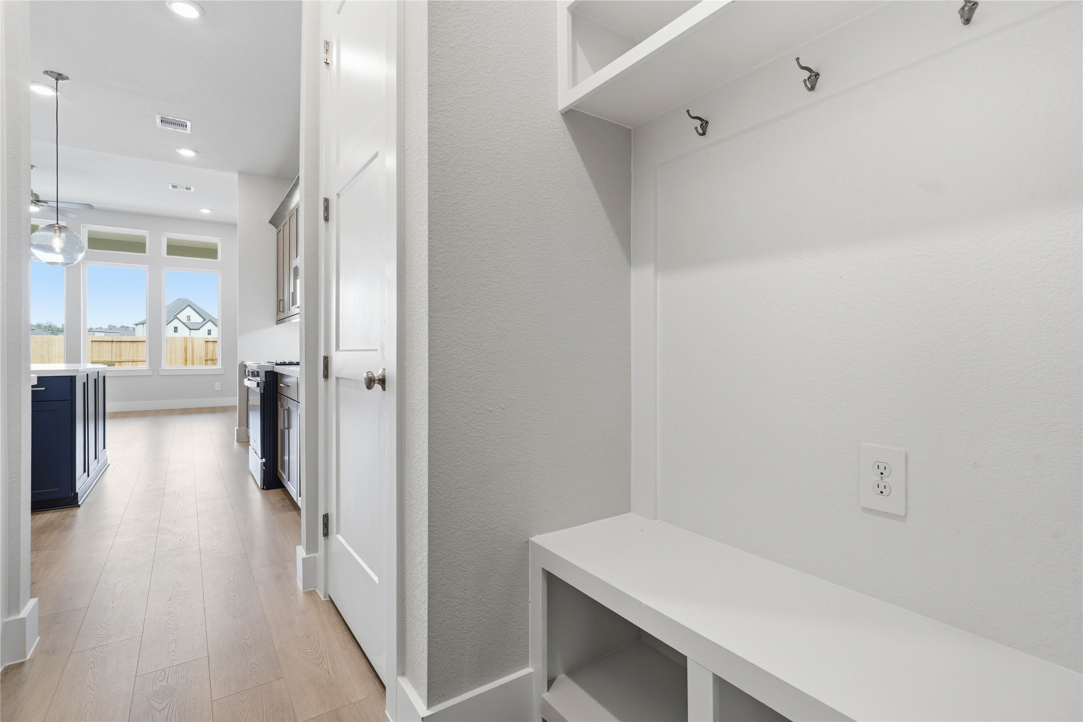 The ultimate in organization and cleanlinessa dedicated mudroom designed to manage daily life with ease. This highly desirable space serves as the perfect "drop zone" between the outdoors and your main living areas, helping to keep your home tidy and clutter-free.