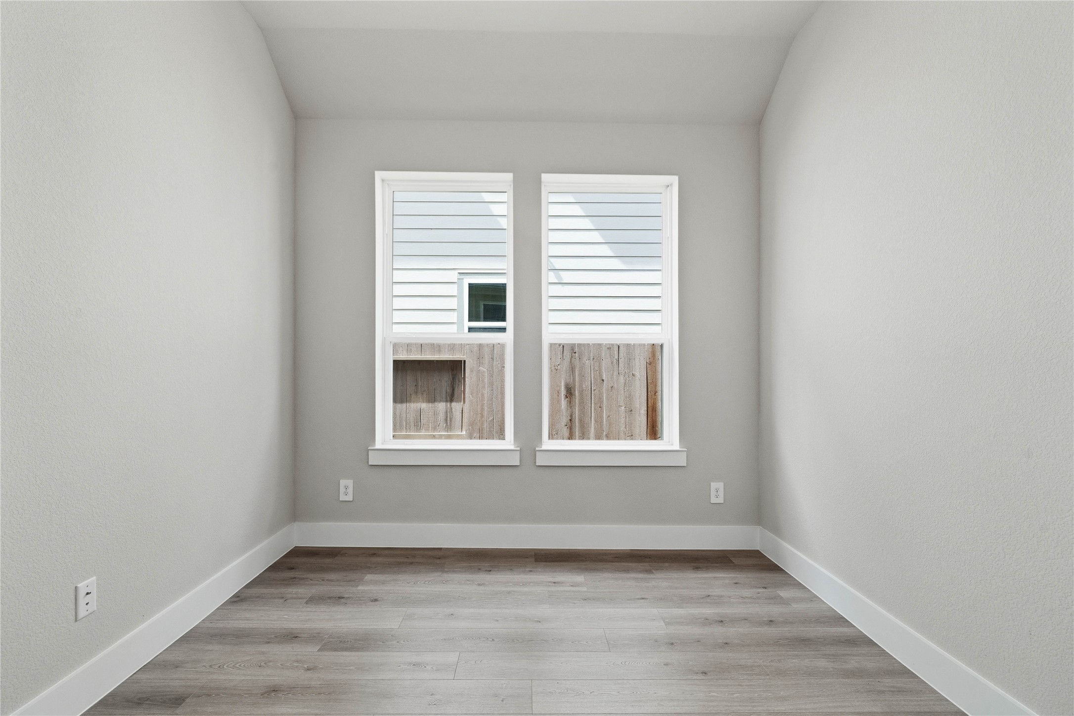 The Study provides the quiet retreat necessary for a productive home office, eliminating the daily commute and maximizing work-from-home efficiency. It features French doors, neutral toned walls, and large windows.