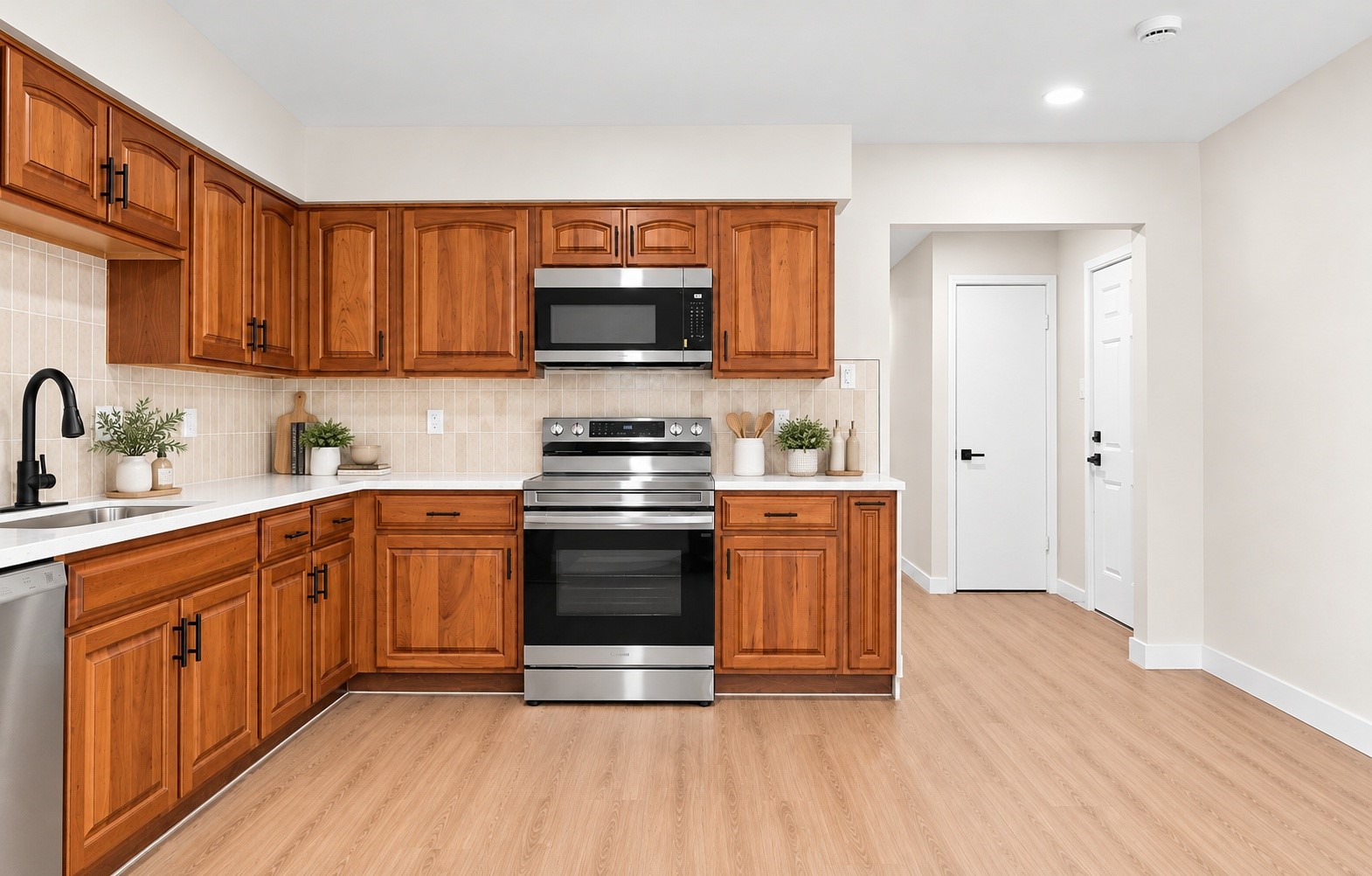 The updated kitchen with brand new cabinets and quartz countertops!