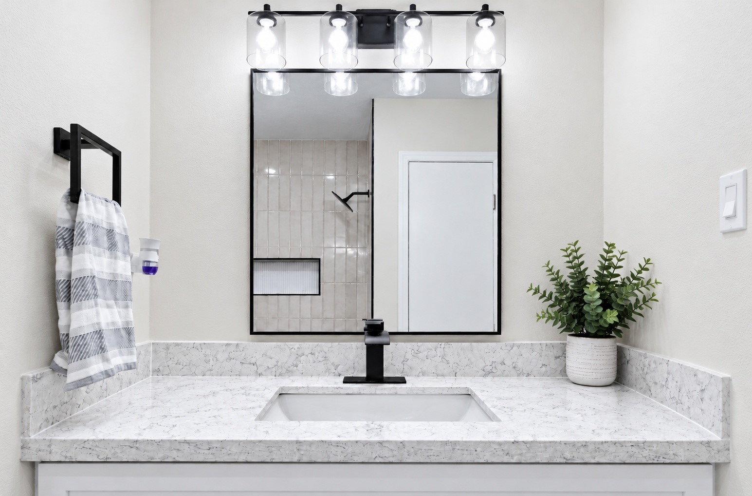An angle of the vanity with quartz countertops!