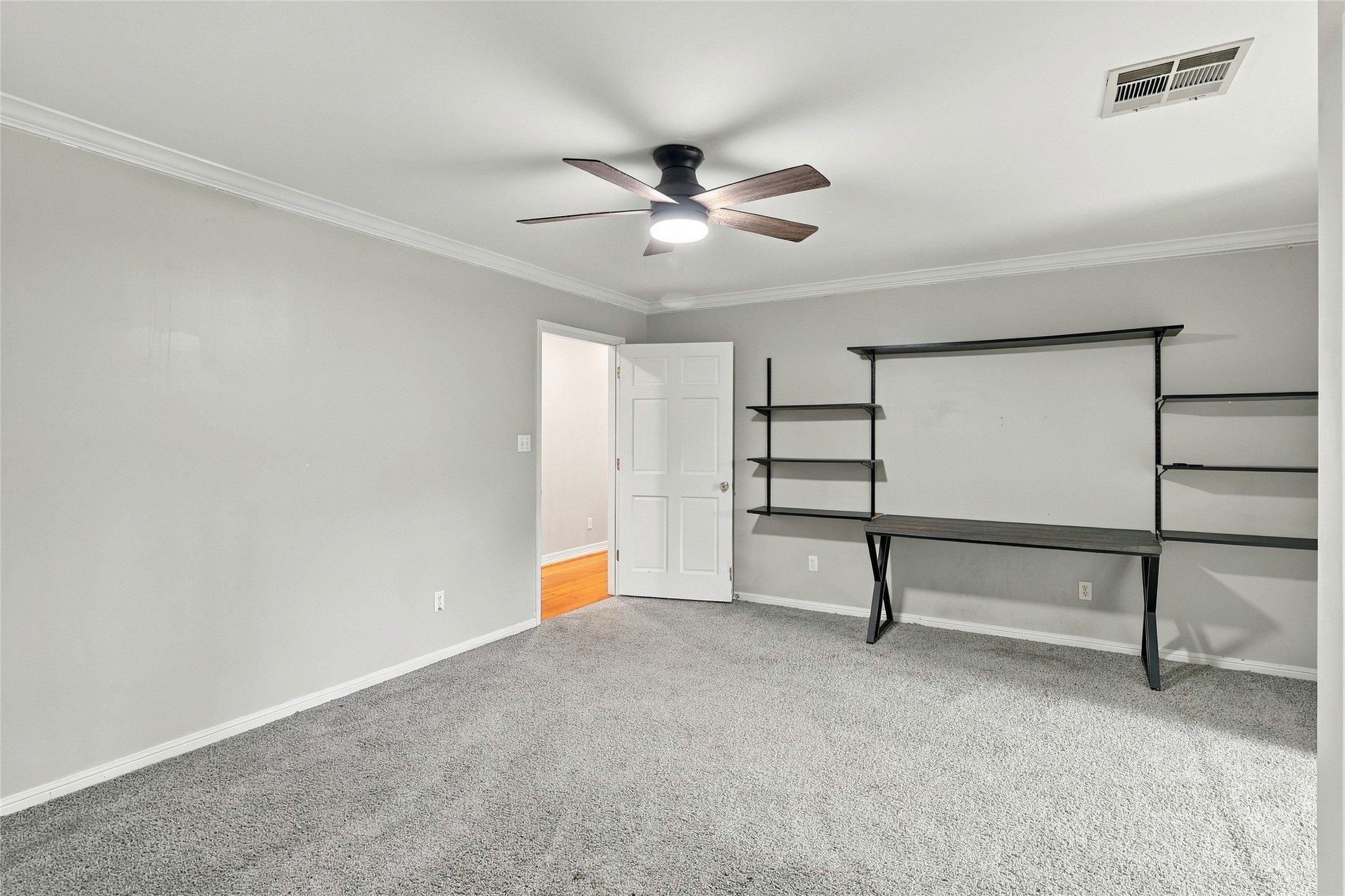 Generously sized secondary bedroom featuring ample space to comfortably relax, study, or work.